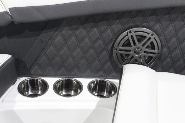 2025 Cobalt R6 interior with cup holders and speaker, featuring quilted upholstery.