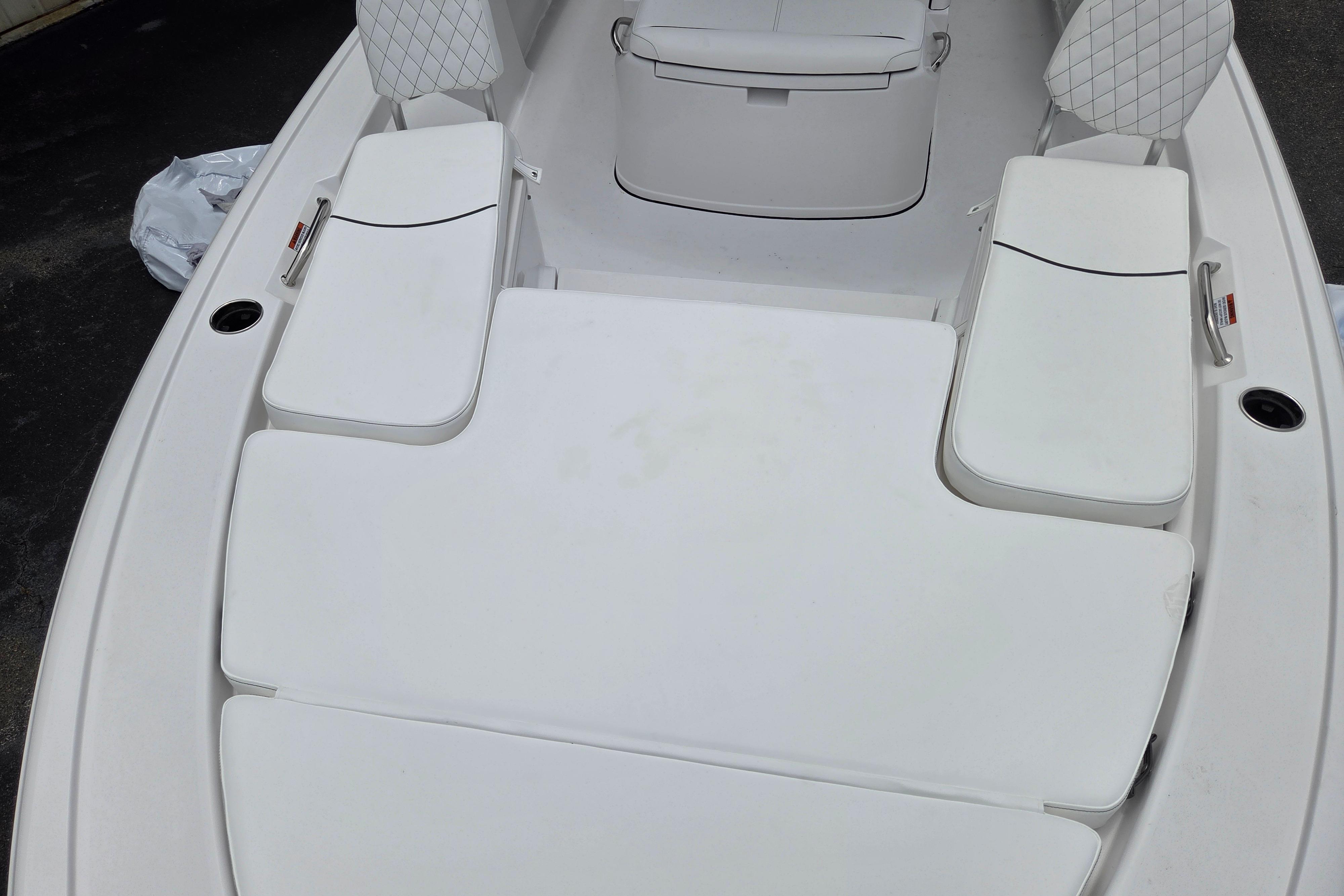 2026 Sportsman Masters 247 Bay Boat with cushioned seating and storage compartments.