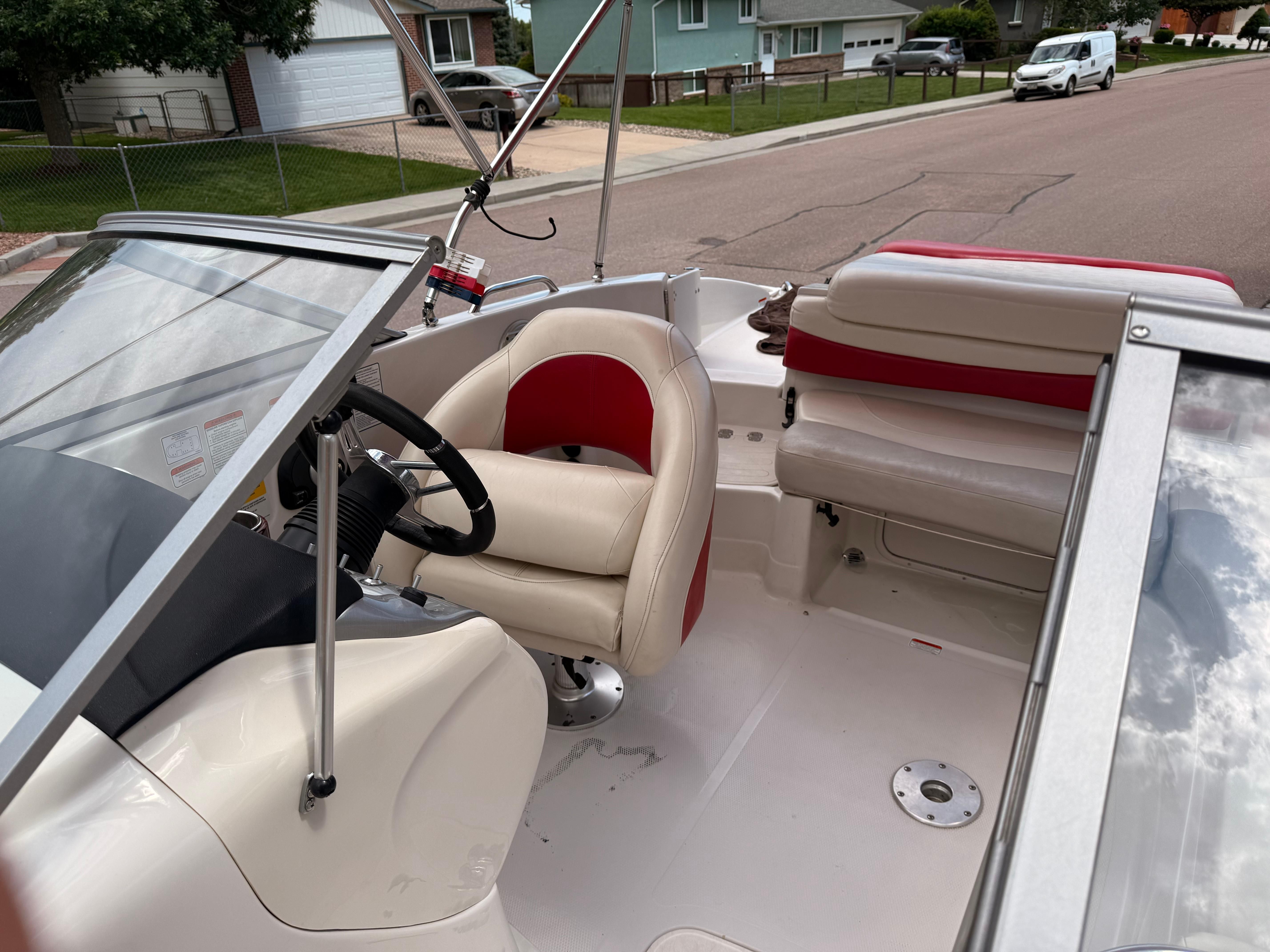 Interior of a 2011 Tahoe 216 WT boat on a street.