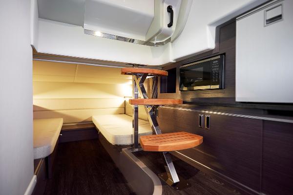 Manufacturer Provided Image: Interior cabin of 2023 Sea Ray Sundancer 320 with wooden steps and modern furnishings.