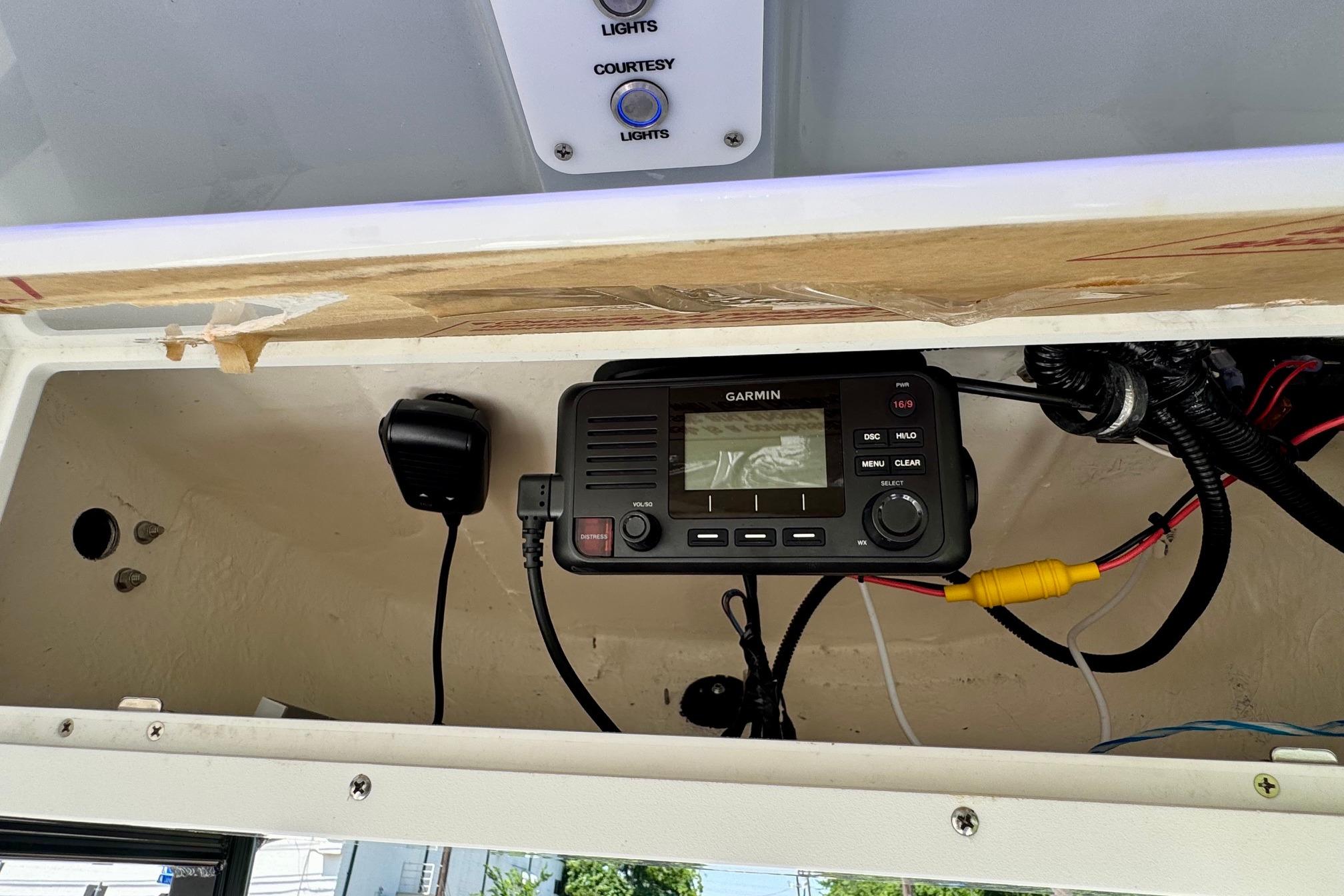 Garmin marine radio installed in 2025 Sea Hunt Ultra 219 boat console.