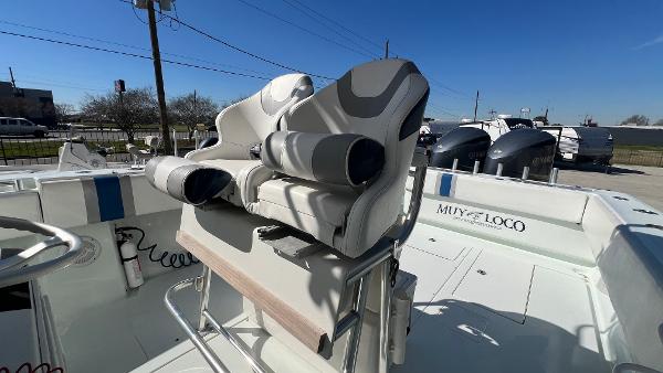 2005 Contender 36 Open boat with dual seats and Muy Loco name on the side.