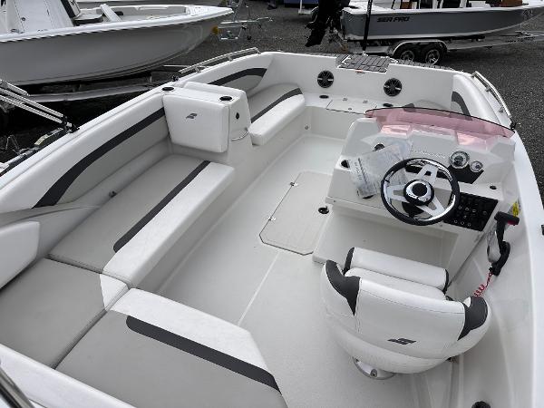 2024 Starcraft 171 SVX boat interior with white seating and modern steering console.