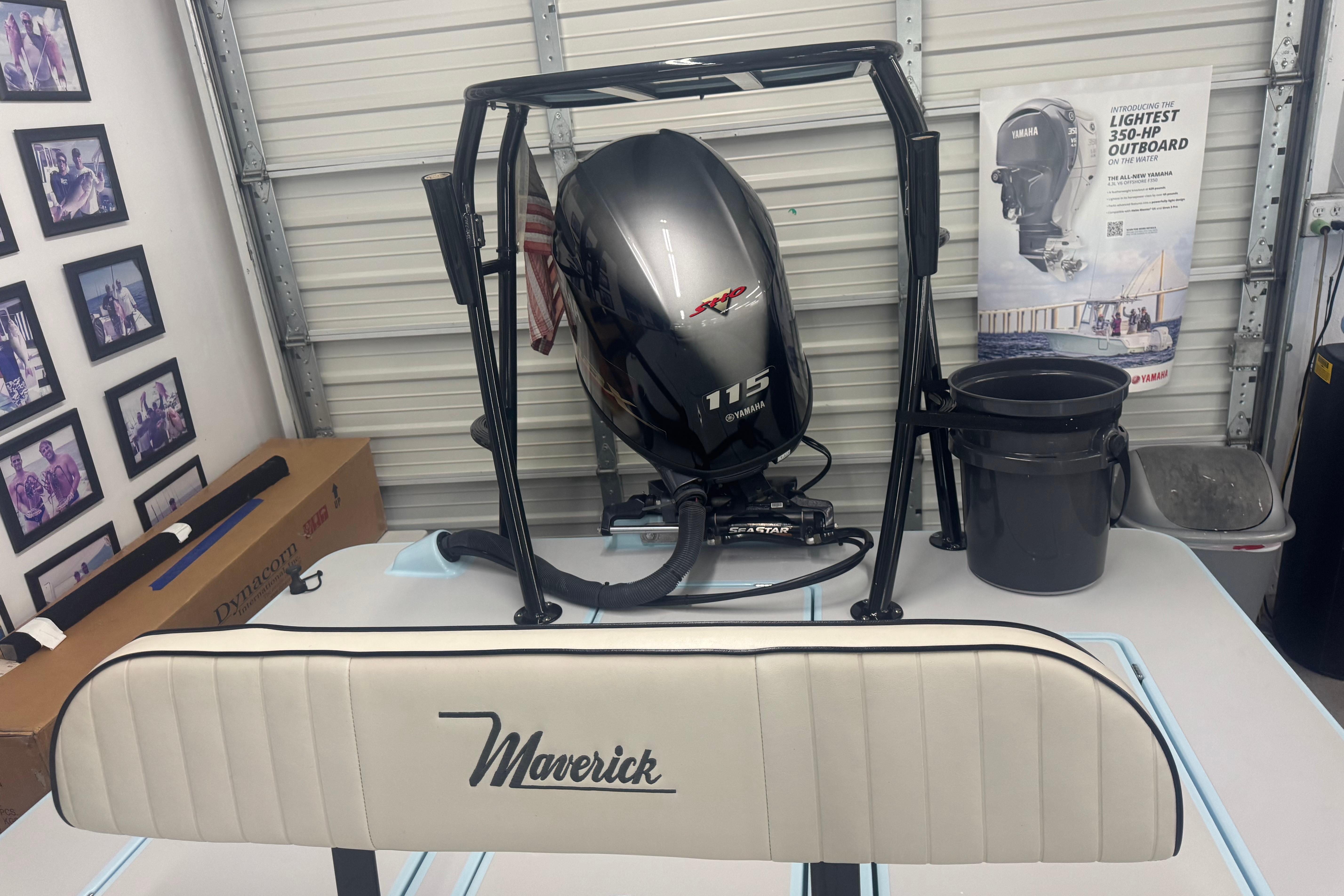 2020 Maverick Mirage 18 HPX-V boat with Yamaha 115 outboard motor in garage.