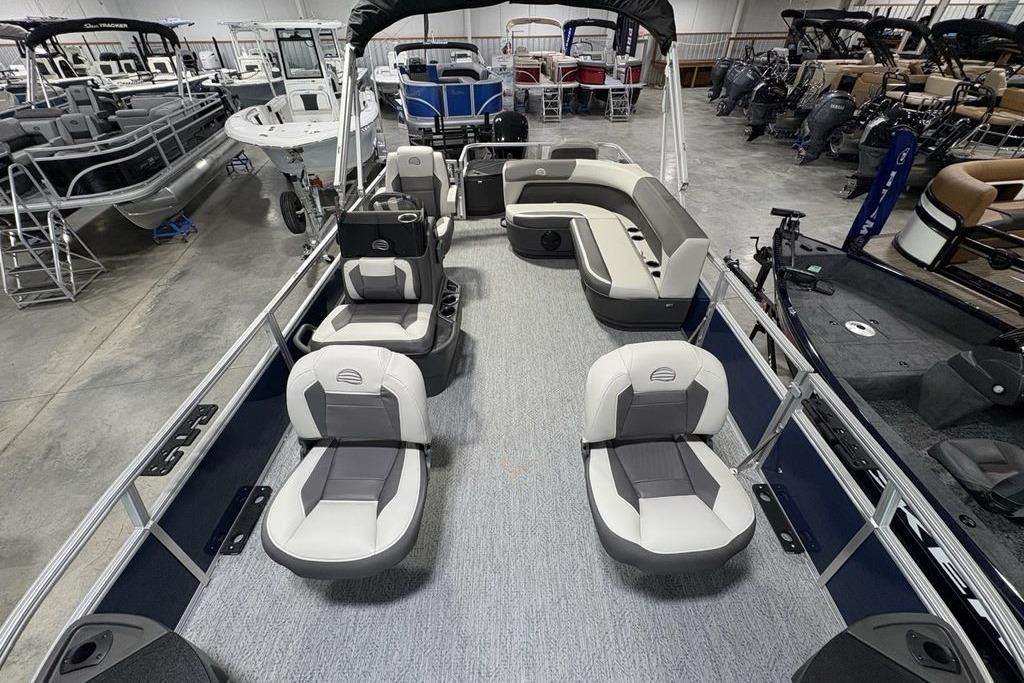 2026 Sun Tracker Bass Buggy 18 DLX pontoon boat interior with seating and helm.