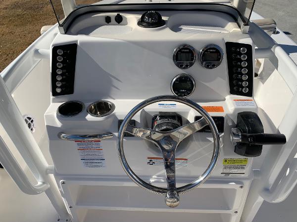 2024 Robalo 226 Cayman boat console with steering wheel and control panel.