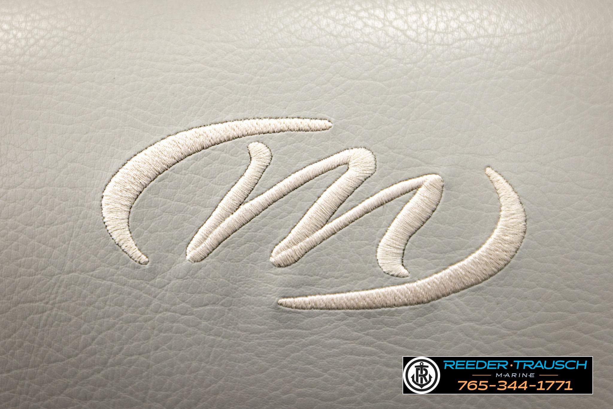 Embroidered Manitou logo on 2019 Oasis SR VP boat upholstery, Reeder-Trausch Marine contact details.