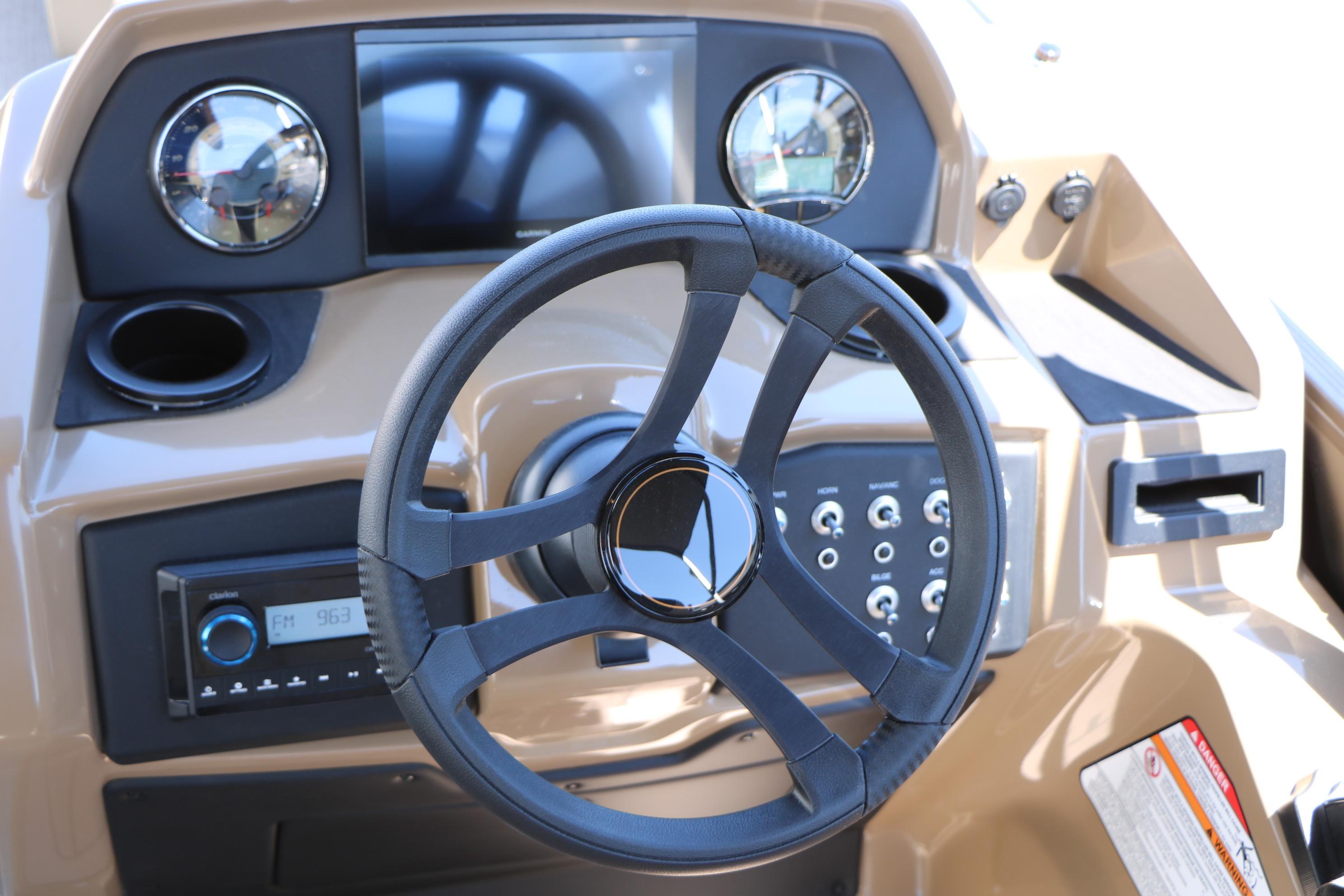 Steering console of 2026 Evotti 521CS boat with modern controls and gauges.