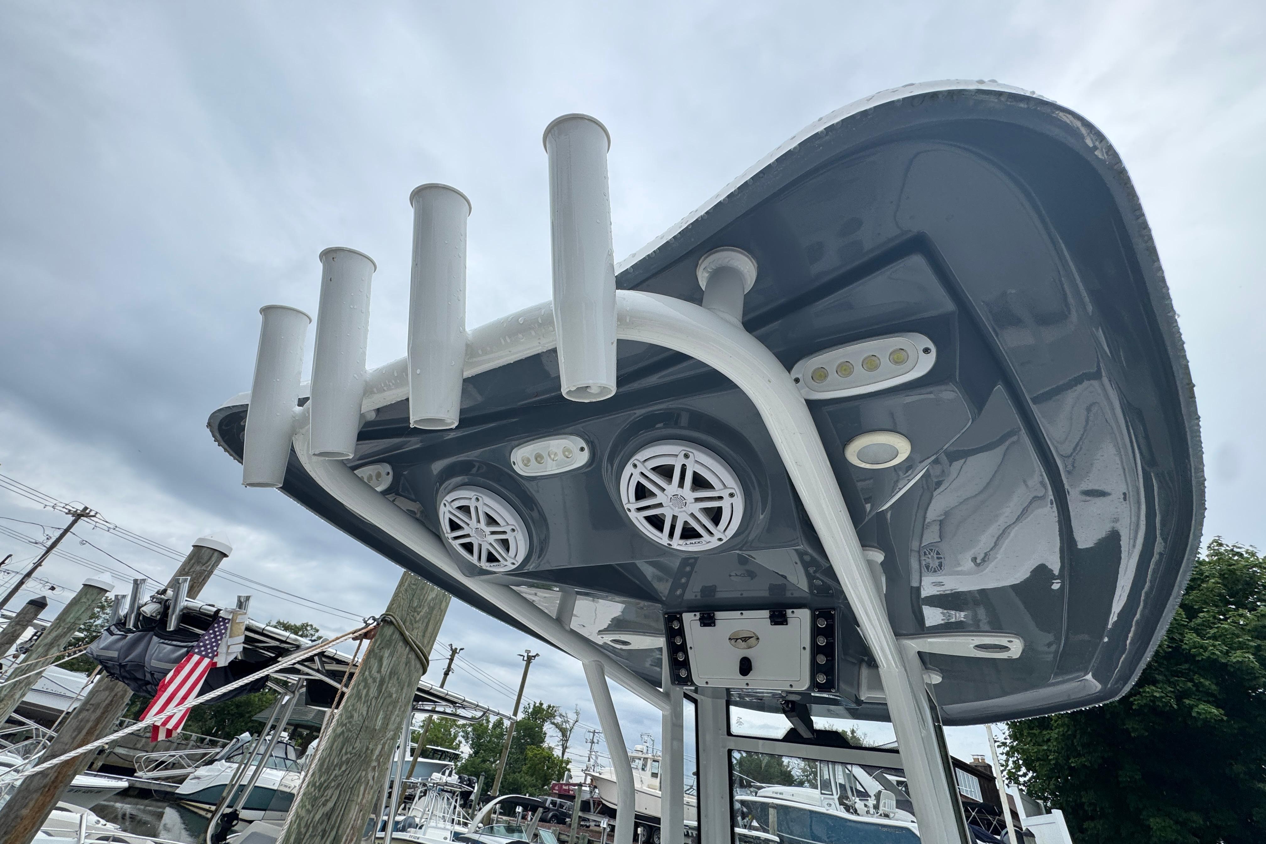 2022 Tidewater 232 SS boat with rod holders and speakers on the T-top.