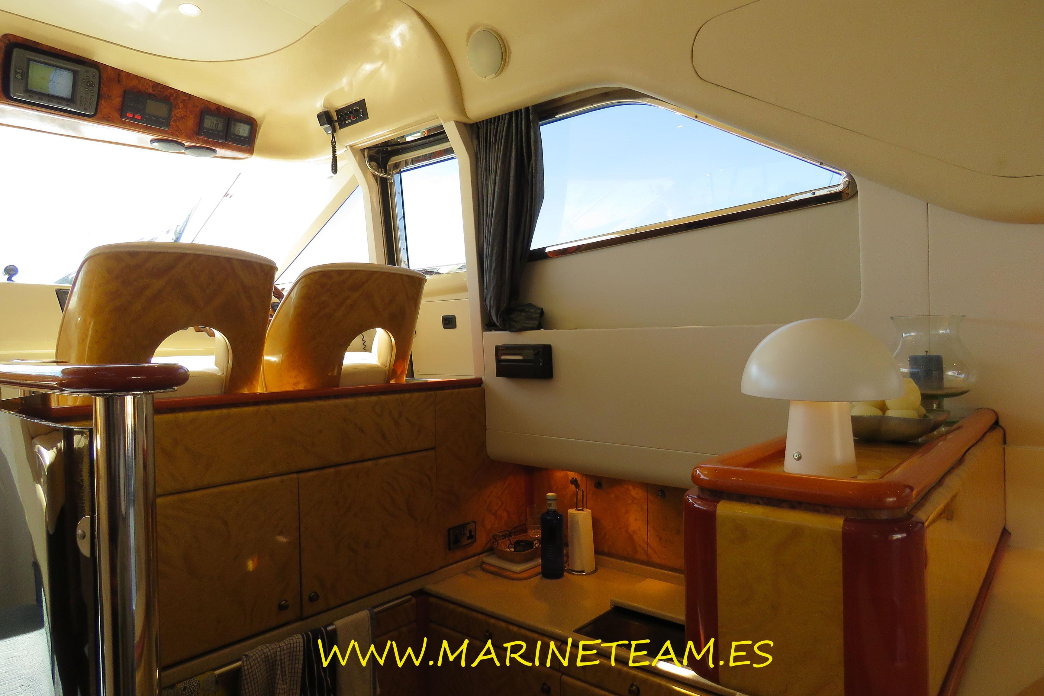 Interior of a 1995 Princess 60 yacht with elegant wood finishes and modern amenities.