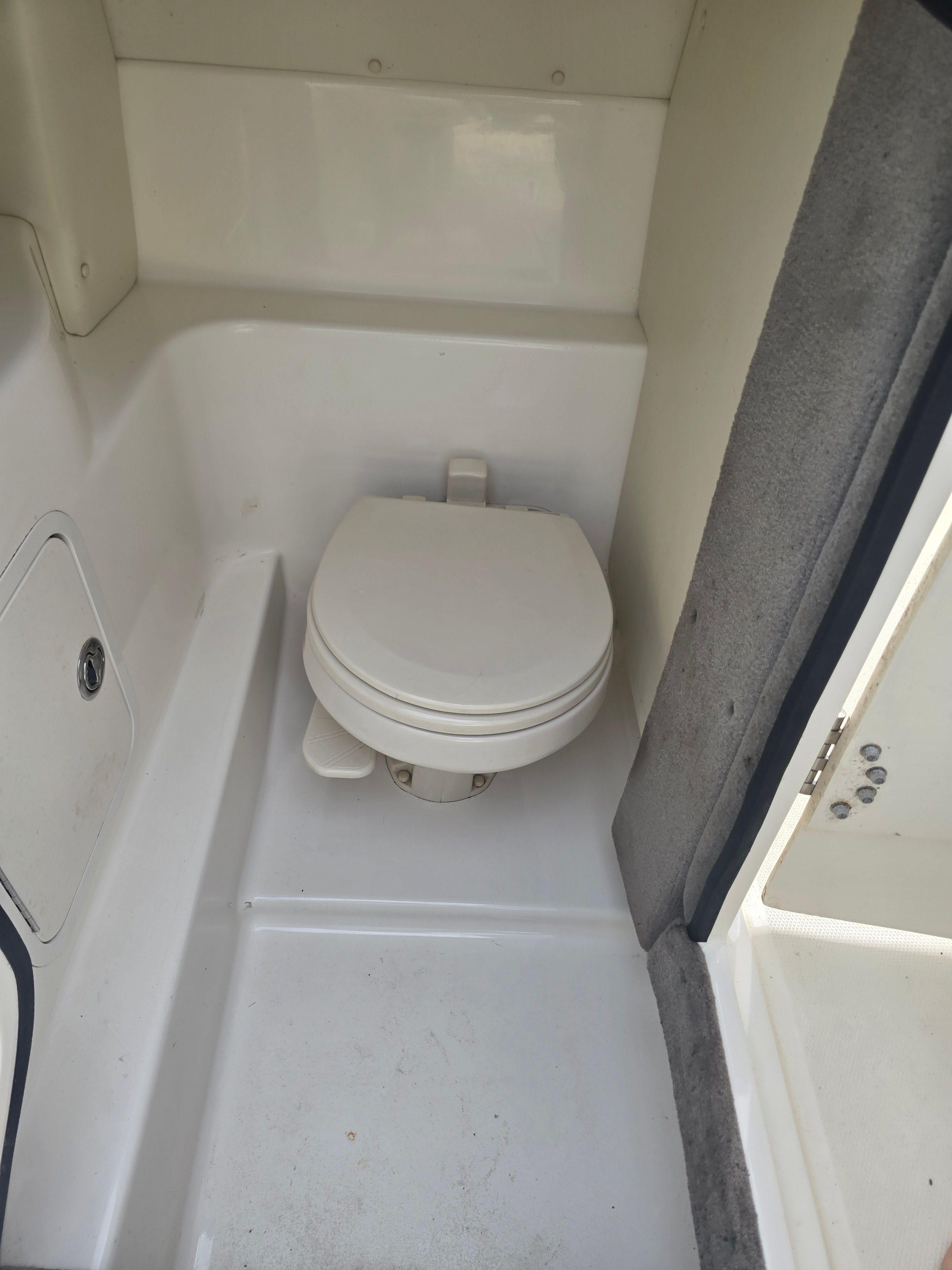 Interior of a 2007 Sea Ray 270 Select EX with toilet.