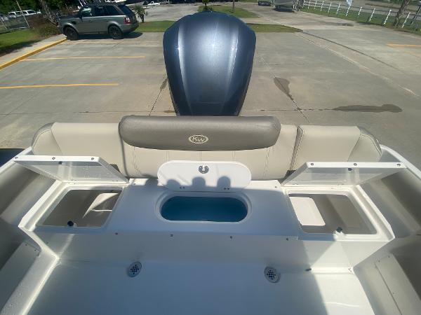 2024 Key West 239 FS boat rear seating and storage compartments.