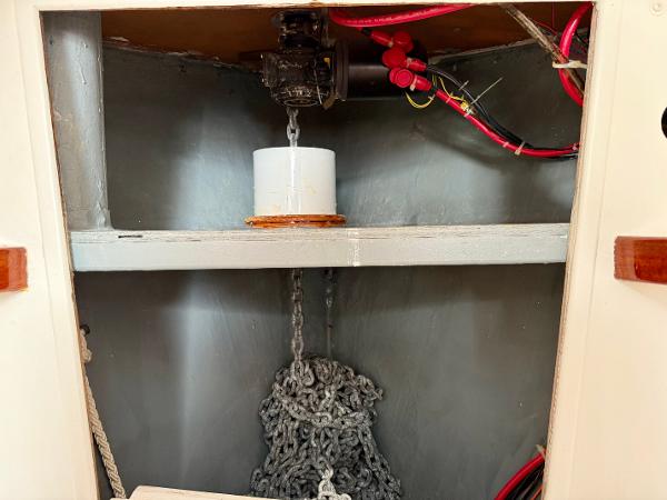 Anchor chain storage in 1978 Dyer 29 Trunk Cabin boat.