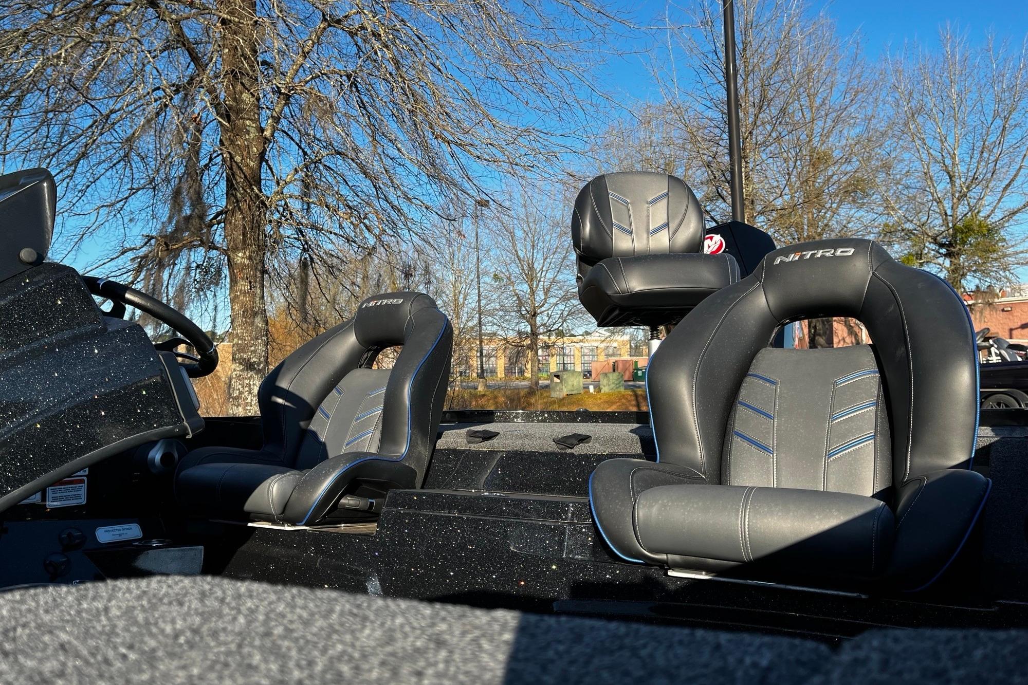 2024 Nitro Z19 boat interior with sleek black seats and steering wheel.