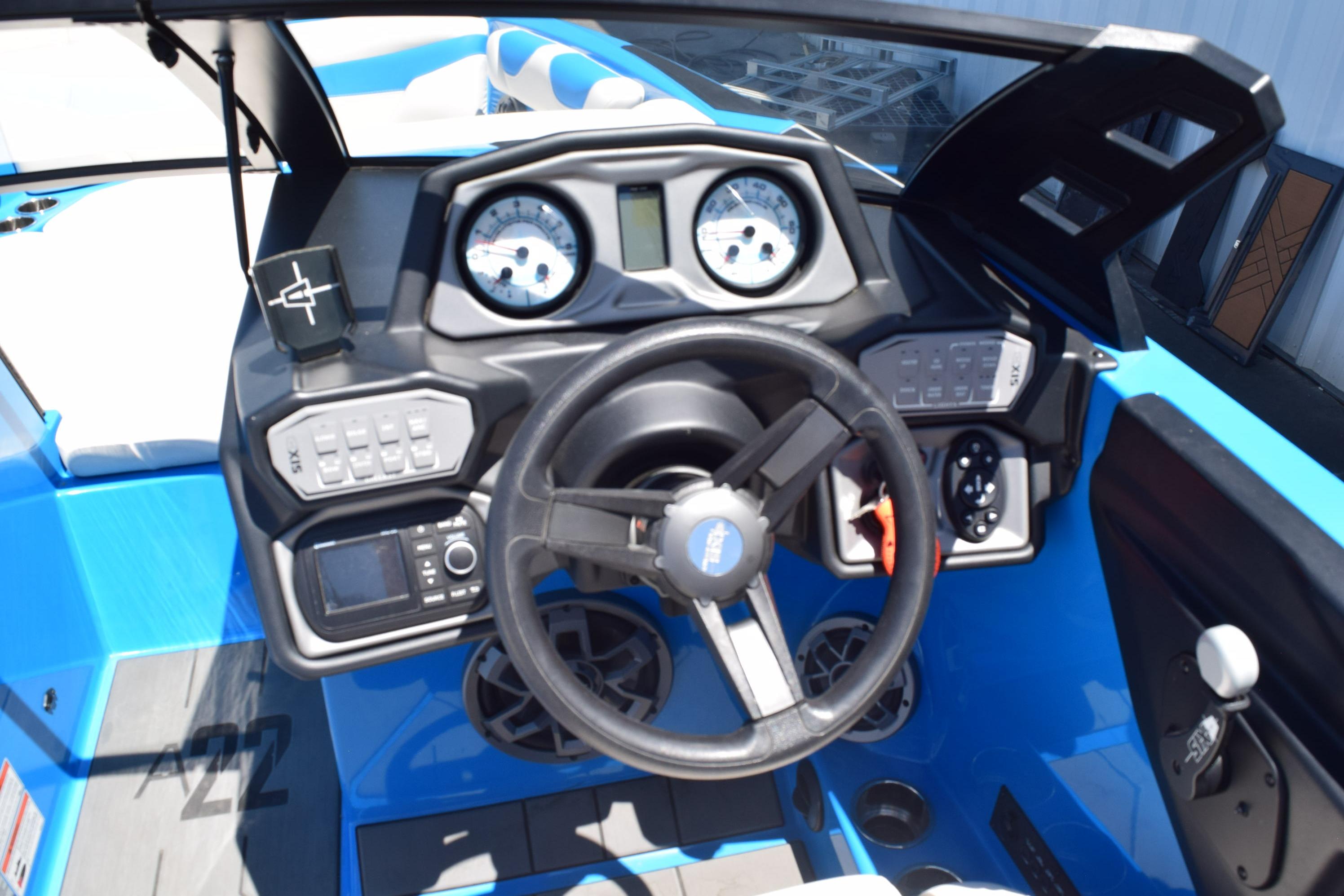 2019 Axis A22 boat dashboard with steering wheel and control panel.