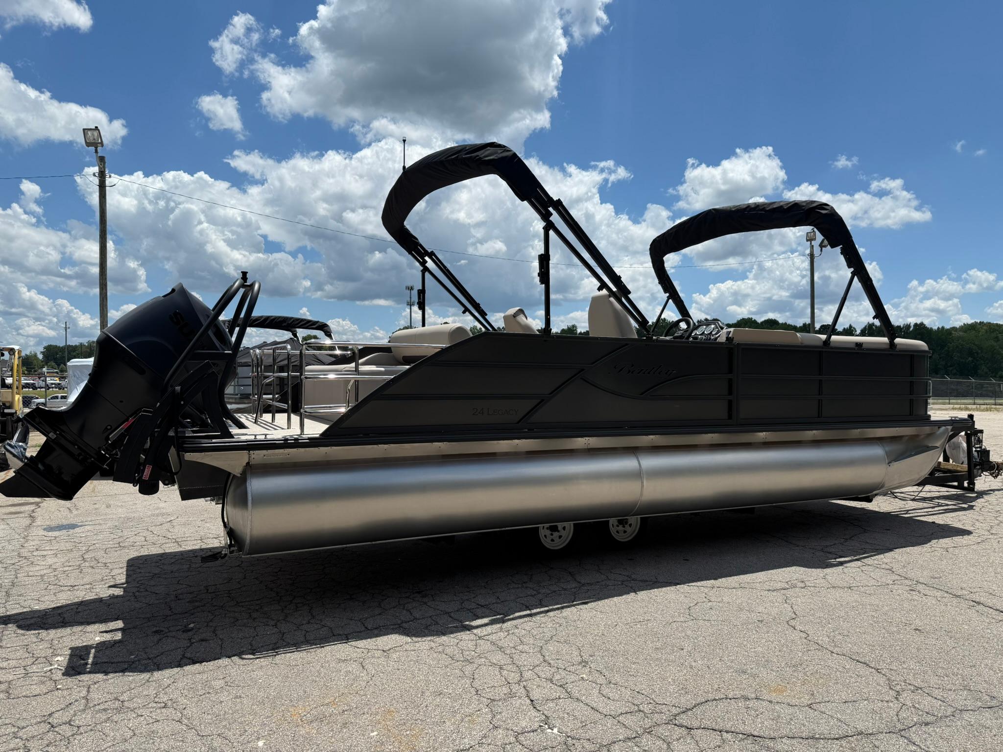 2026 Bentley Pontoons Legacy 243 Swingback on a sunny day, showcasing sleek design and modern features.
