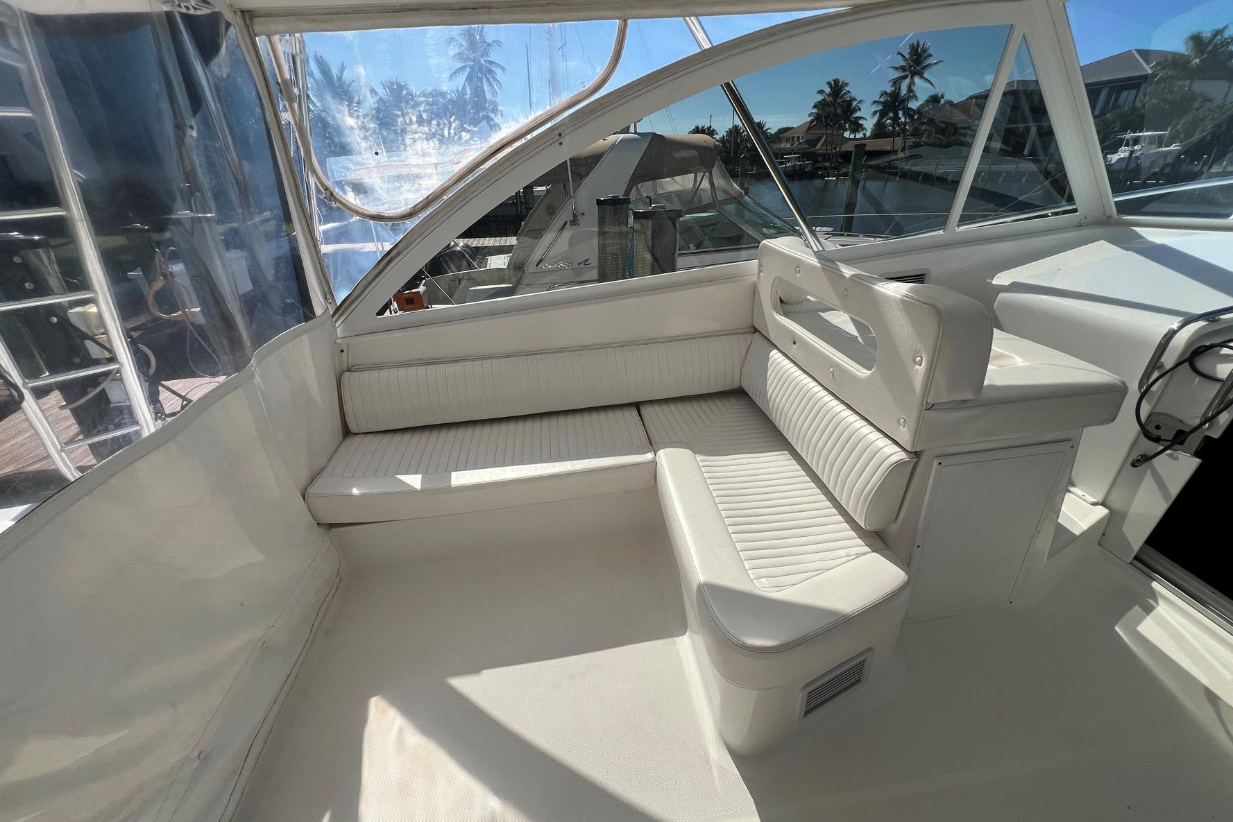 2007 Luhrs 41 Hardtop boat interior with white seating and clear windows.