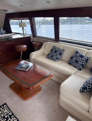 Luxurious interior of 1986 Egg Harbor 60 Sportfisherman yacht with elegant seating and decor.