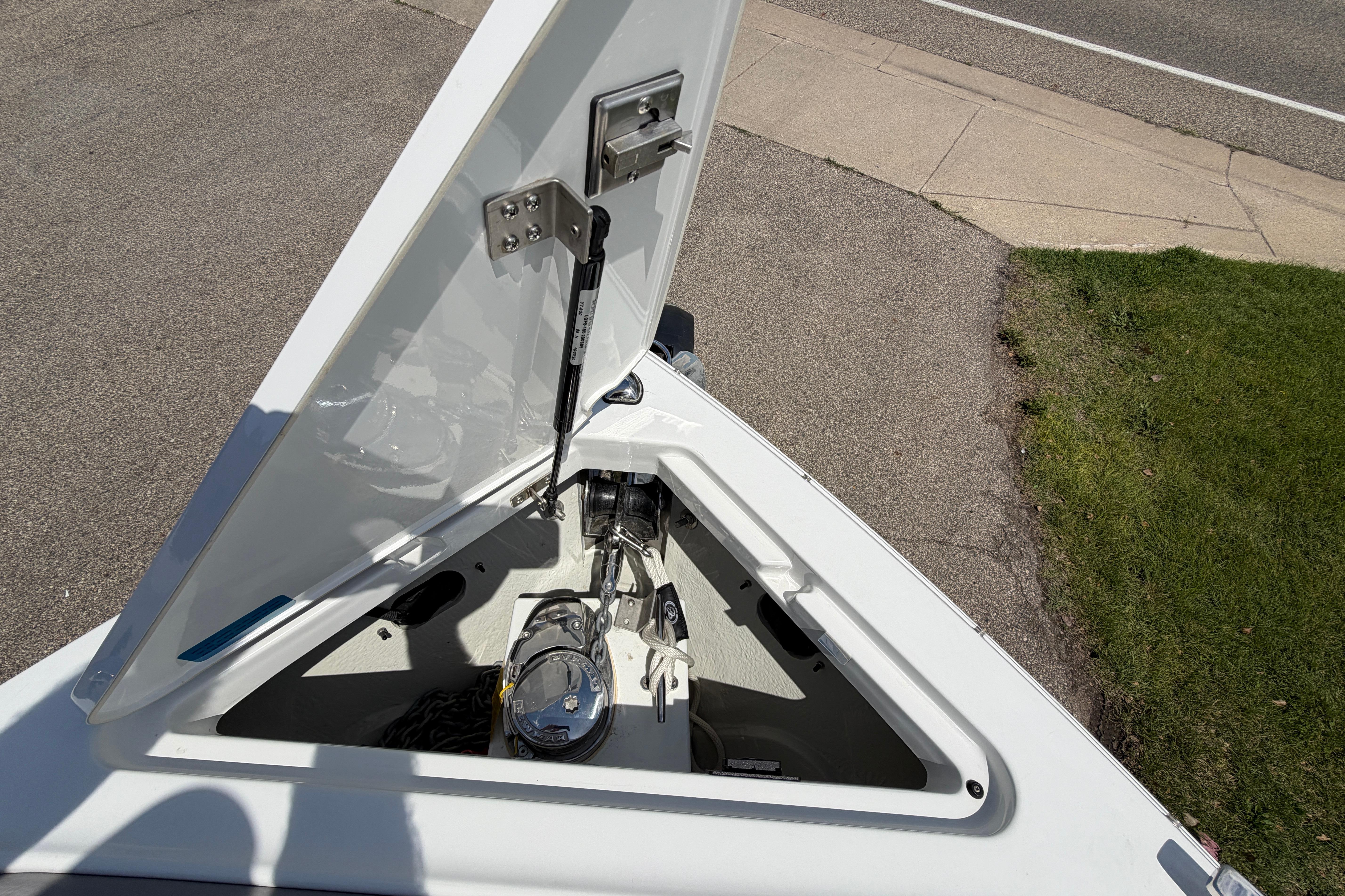 Open anchor compartment of 2021 Cobalt R8 Surf boat, showing mechanical details.