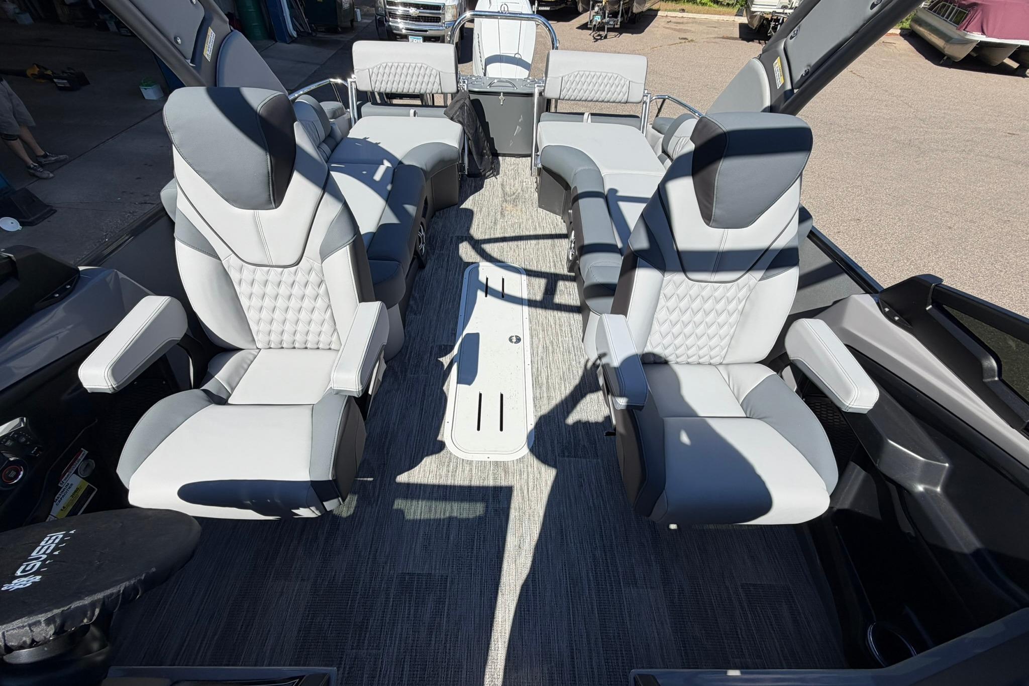 Luxurious interior of 2026 Avalon Excalibur LTD Quad Lounge boat with modern seating.