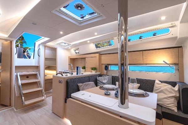 Luxurious interior of 2025 Hanse 360 yacht with modern furnishings and natural light.