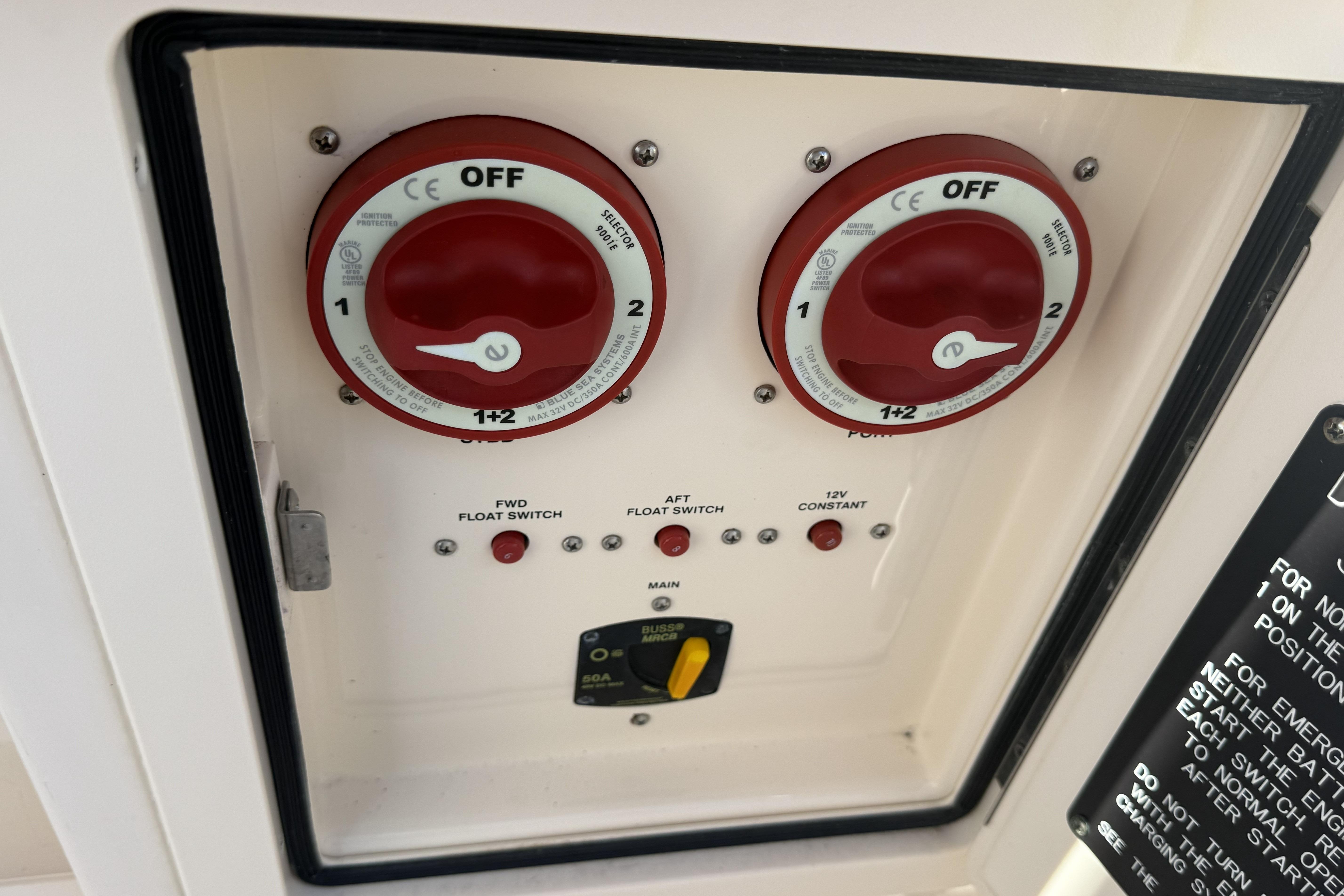 Control panel of a 2014 Grady-White Freedom 275 boat with battery switches.