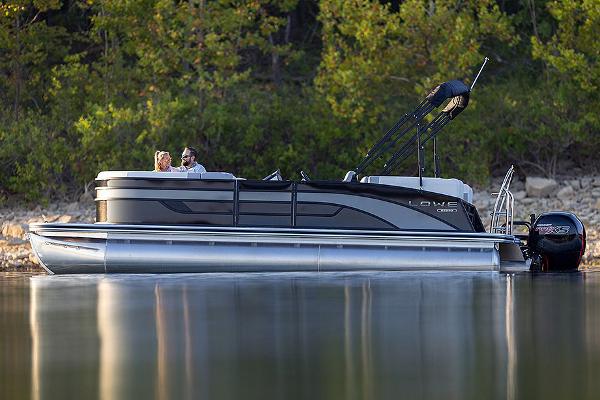 Manufacturer Provided Image: 2025 Lowe SS 230 WV pontoon boat on calm lake with lush green background.
