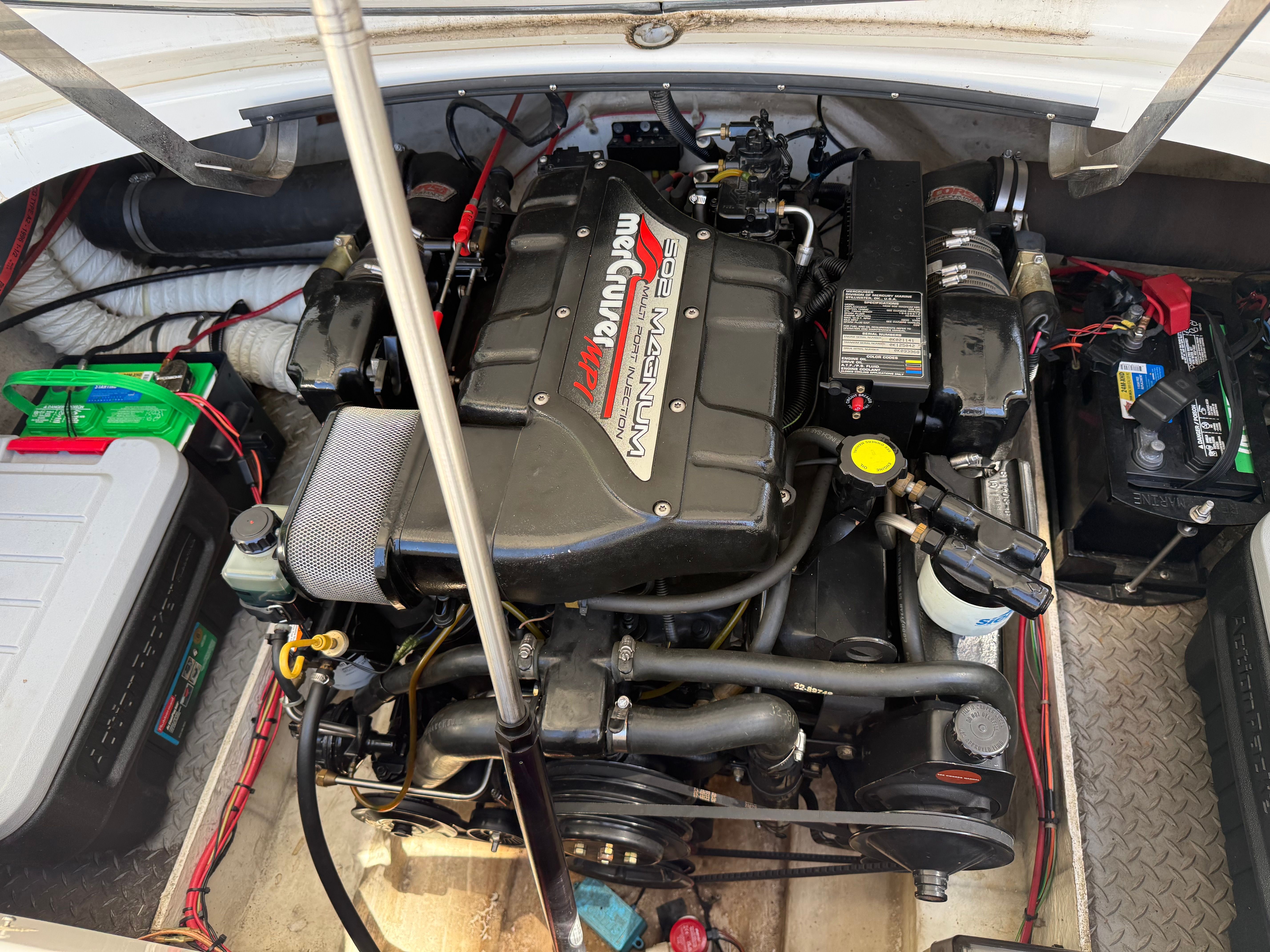 Engine compartment of a 1997 Arriva 2550 boat featuring a powerful engine.