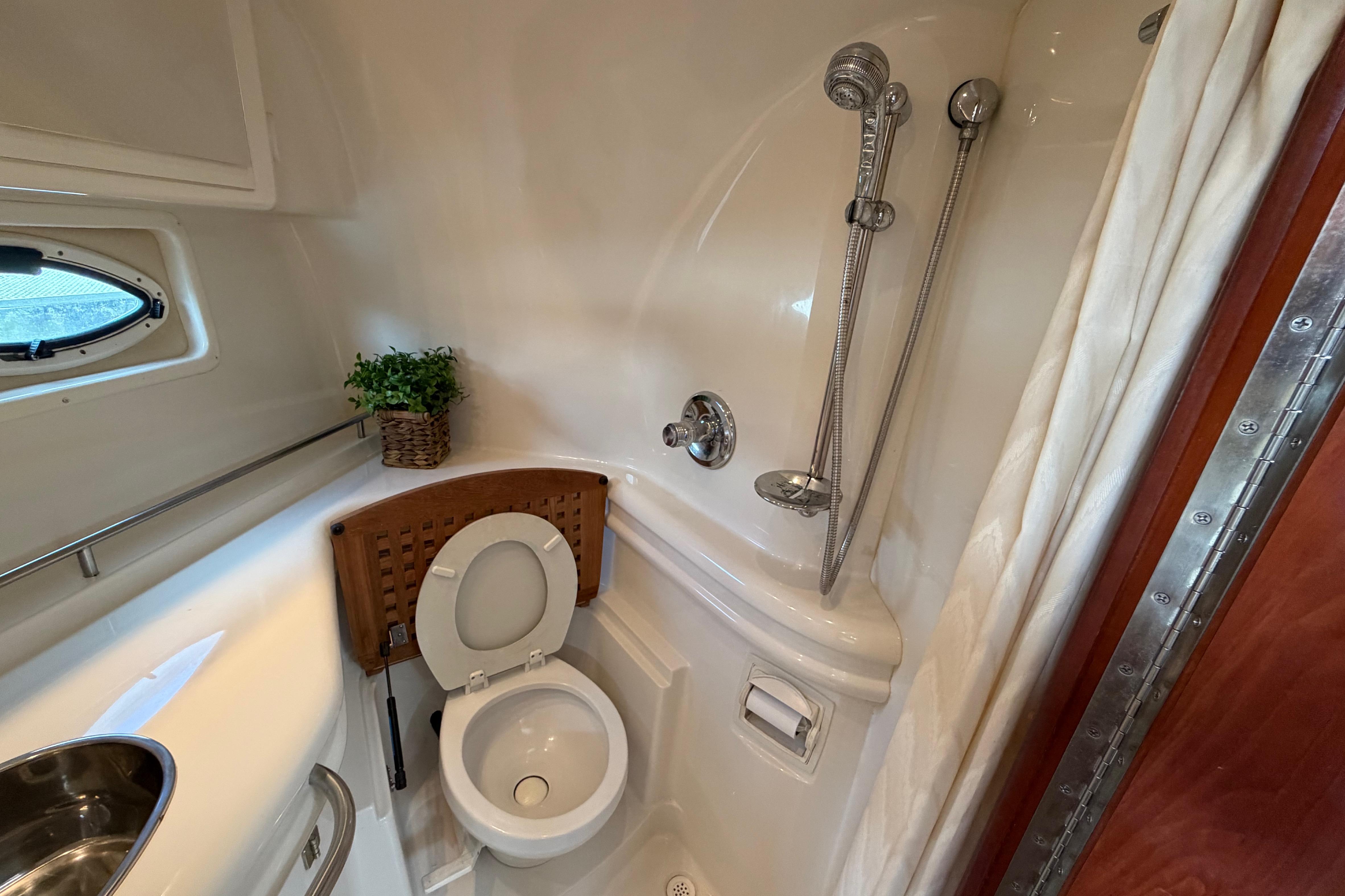 Bathroom interior of 2007 Monterey 350 Sport Yacht with shower and toilet.