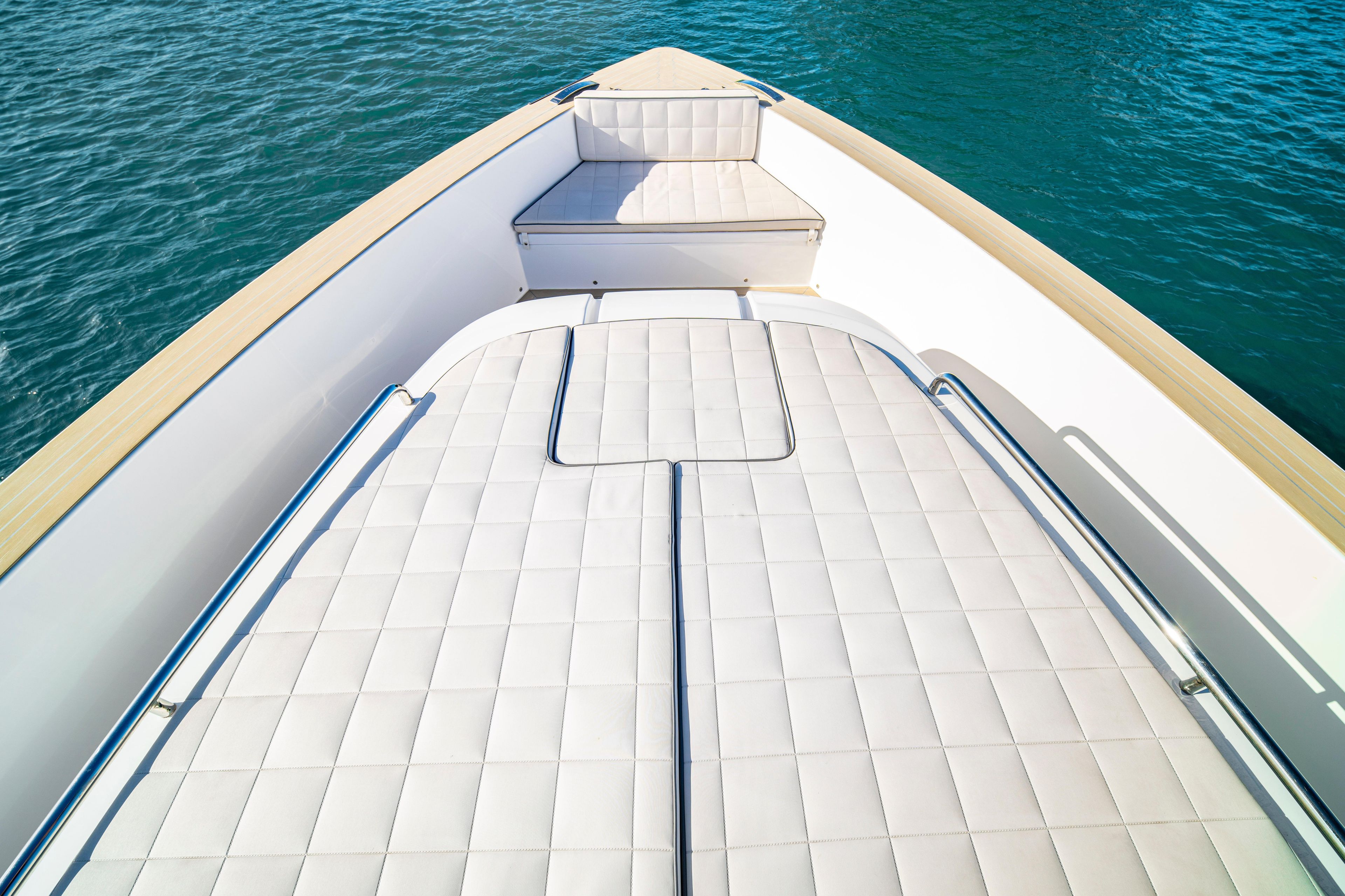 2024 Pardo Yachts P43 deck with cushioned seating, overlooking blue water.