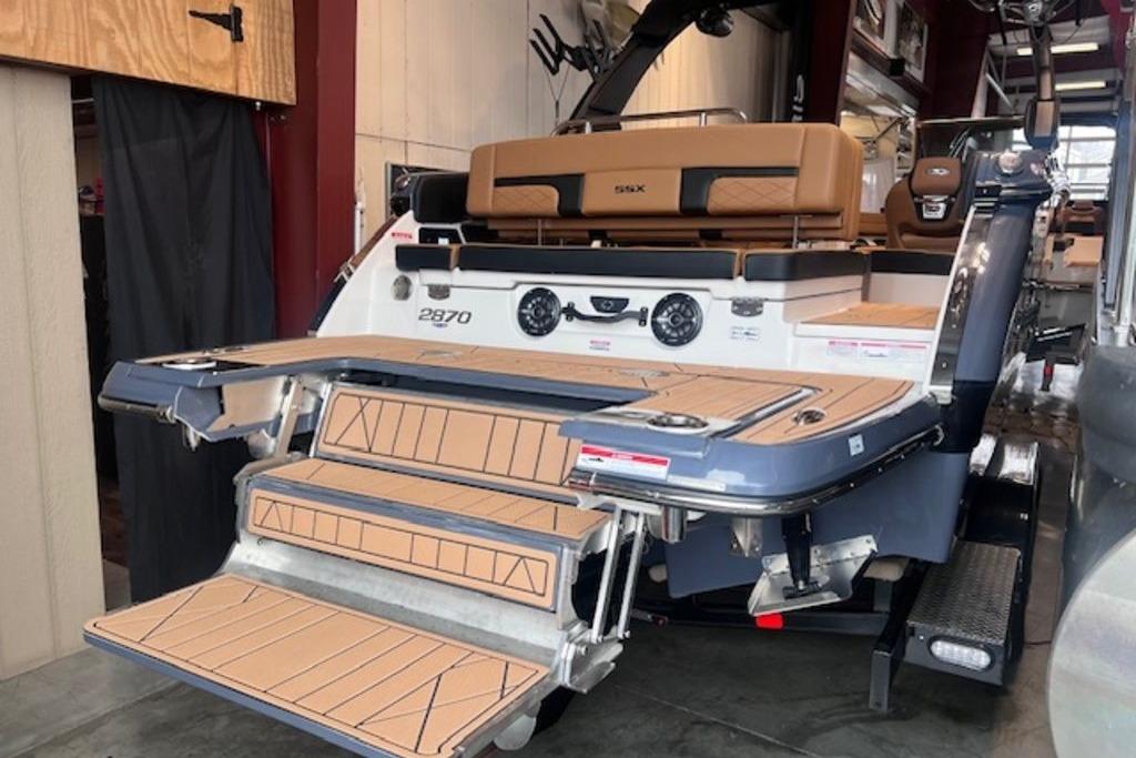 2025 Chaparral 2870 SSX boat with extended swim platform and luxurious seating.