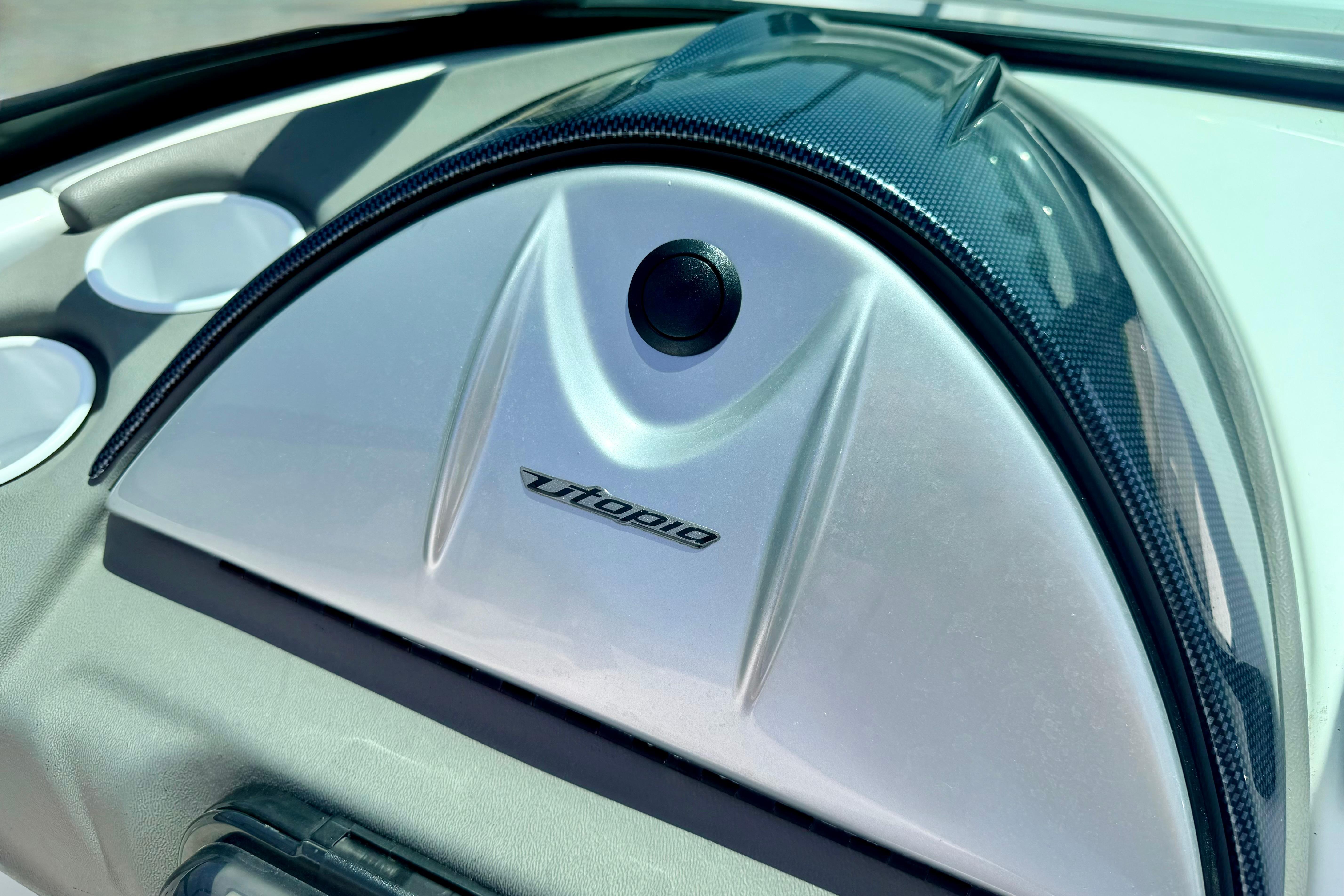Dashboard of a 2004 Bombardier SEADOO Utopia 185 boat, featuring sleek design elements.