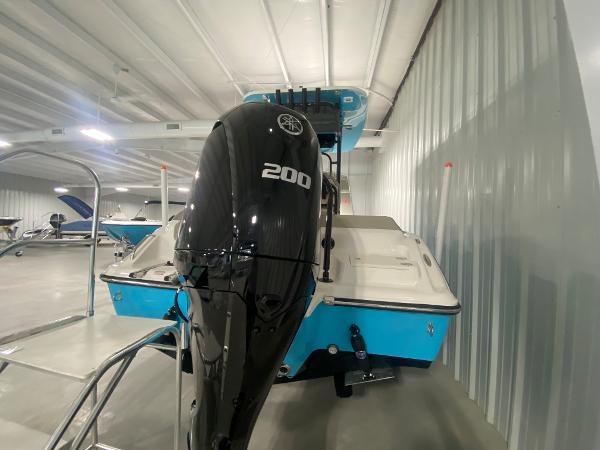 2024 Key West 219 FS boat with 200 HP engine in showroom.