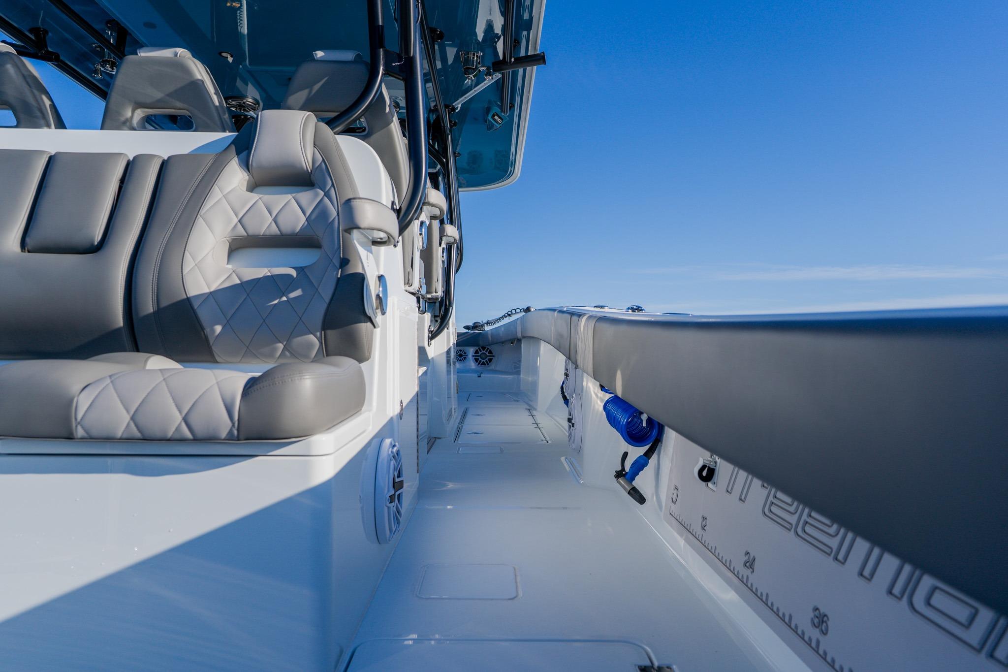 Luxurious interior of 2025 Freeman 42LR boat with plush seating and sleek design.