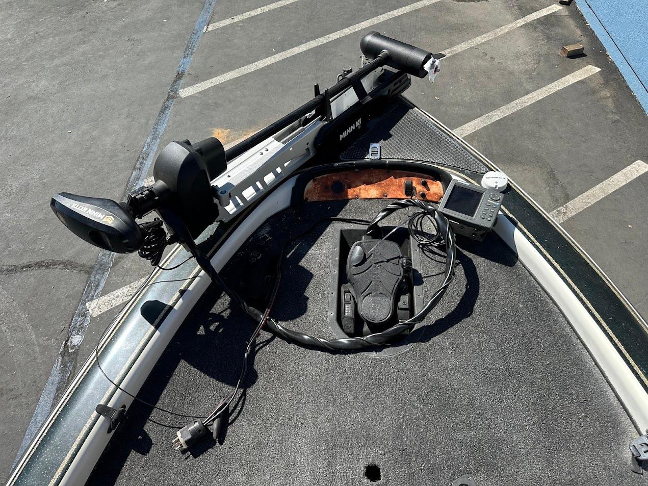 Bow of a 1999 Fisher 21 FX DC boat with trolling motor and fish finder.
