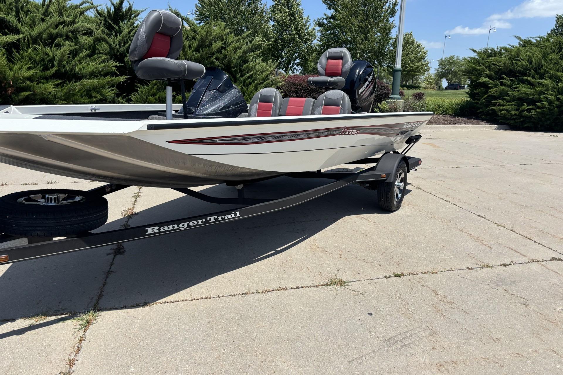 2017 Ranger RT178C boat on trailer, parked outdoors with trees in background.