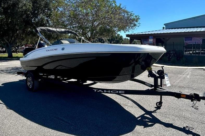 2025 Tahoe T18 boat on trailer in outdoor setting.