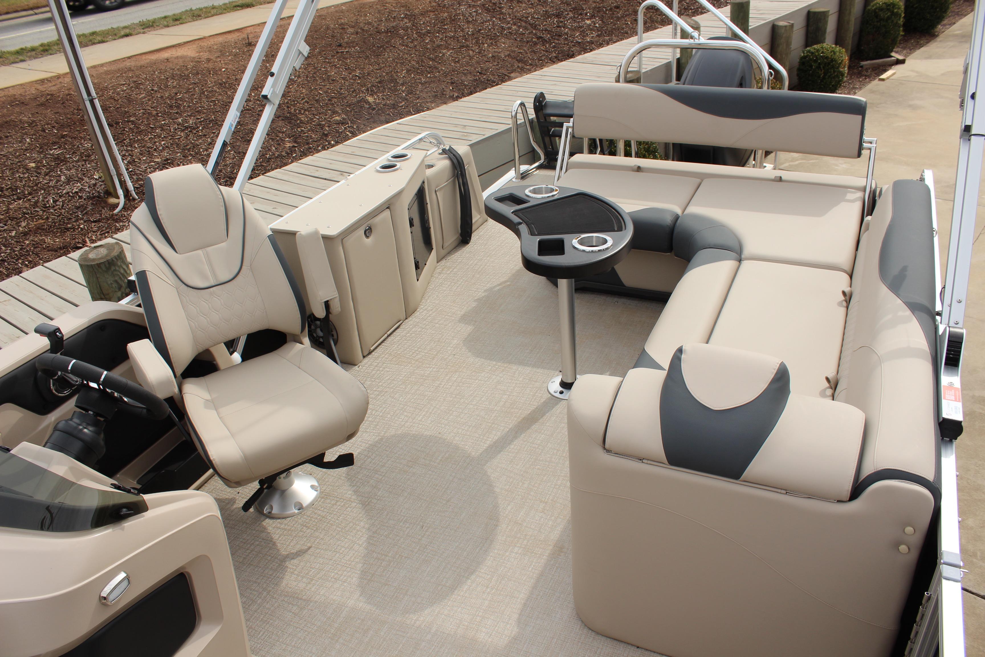 2026 Tahoe Pontoon LTZ interior with beige seating and modern amenities.