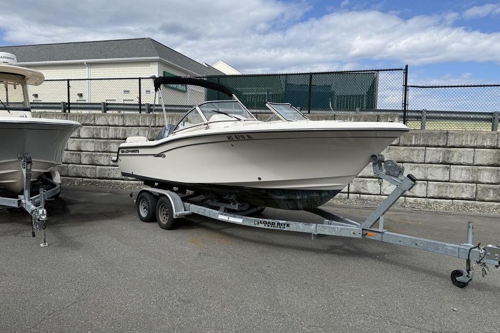 2019 Grady-White Freedom 215 boat on trailer, parked outdoors.