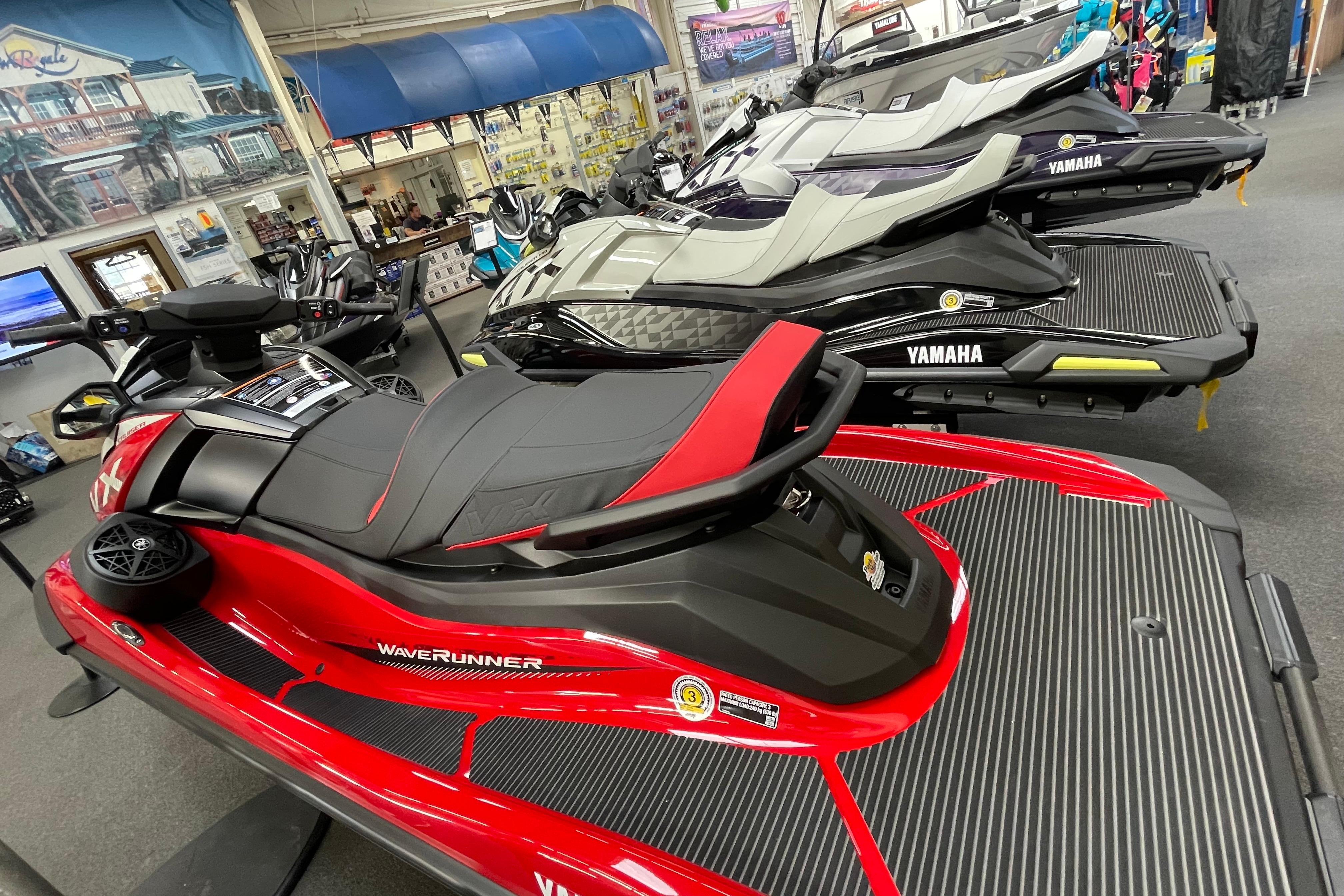 2026 Yamaha WaveRunner VX Cruiser in showroom, featuring sleek design and vibrant colors.