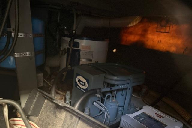 Engine room of 1980 Chris-Craft 381 Catalina with visible machinery and equipment.