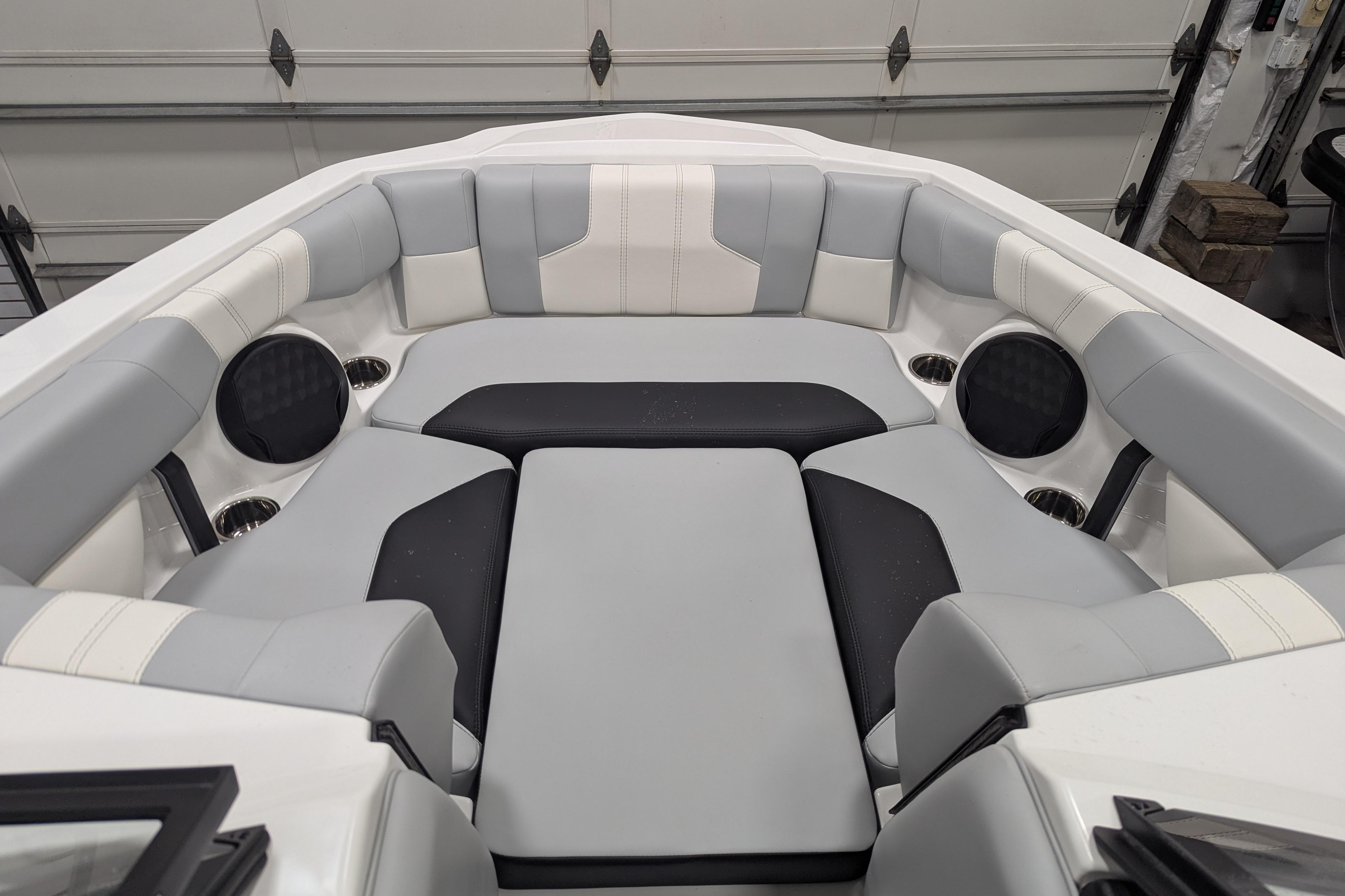 2026 Malibu Wakesetter 21 LX interior with gray and black cushioned seating.