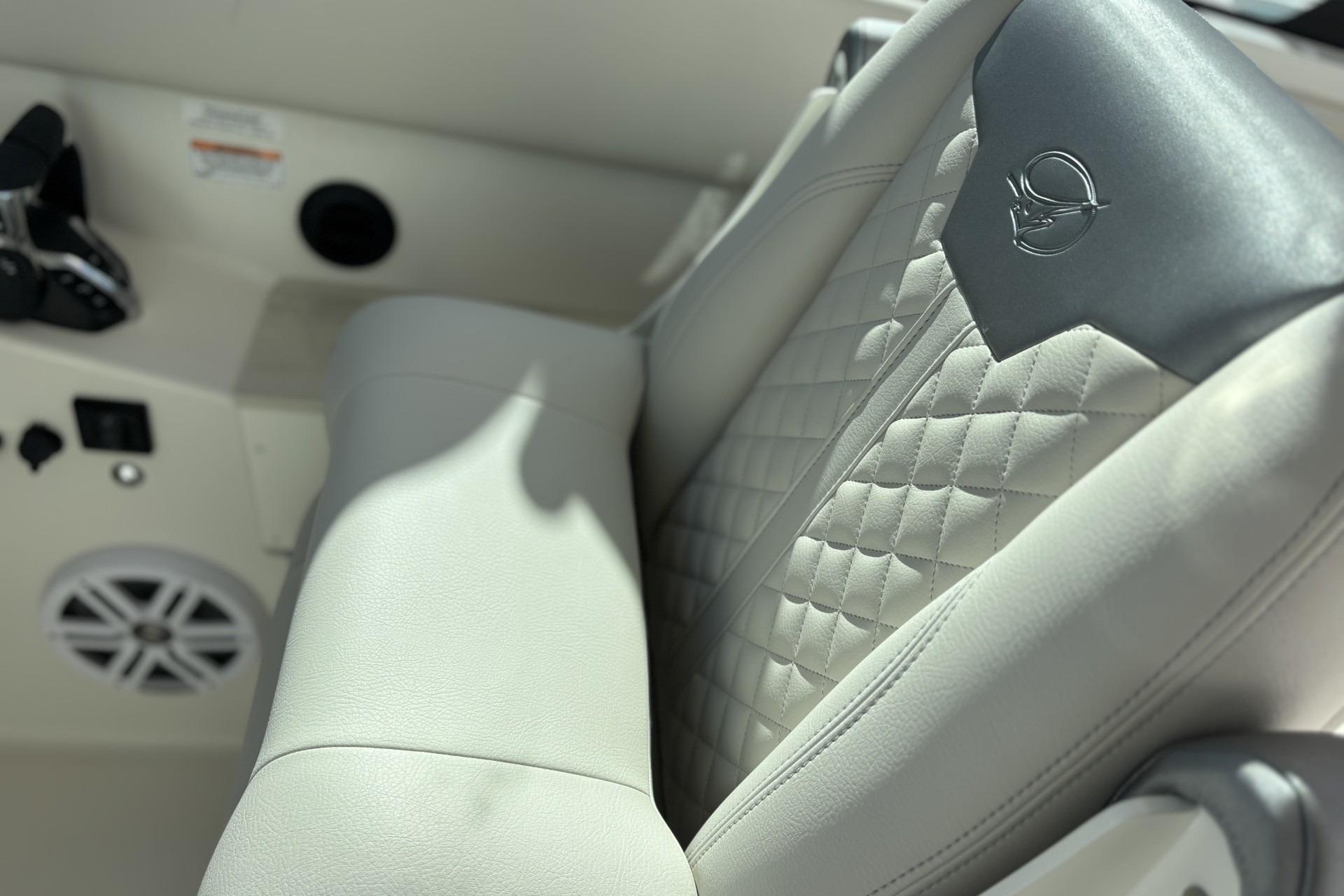 Luxurious seating in 2026 Sailfish 316 DC boat, featuring quilted upholstery and sleek design.