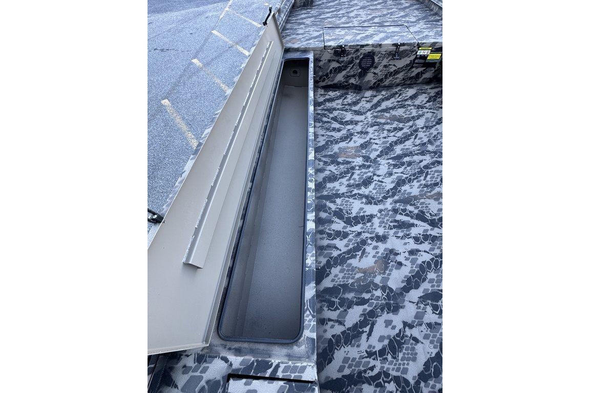 2025 Havoc 1860 boat interior with camouflage pattern and storage compartment.