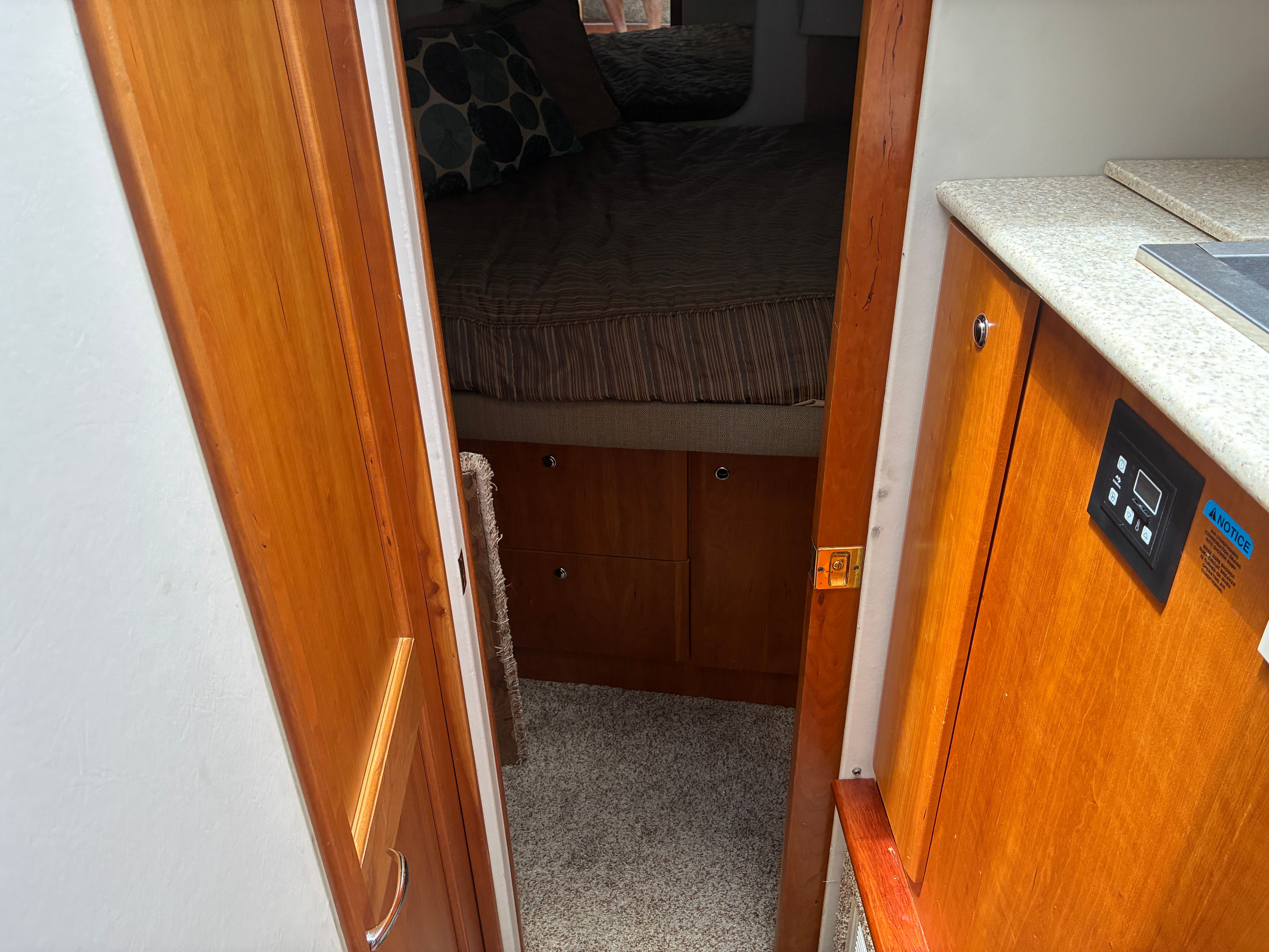Interior of a 2001 Silverton 392 Motor Yacht with wood furnishings and carpeted floor.