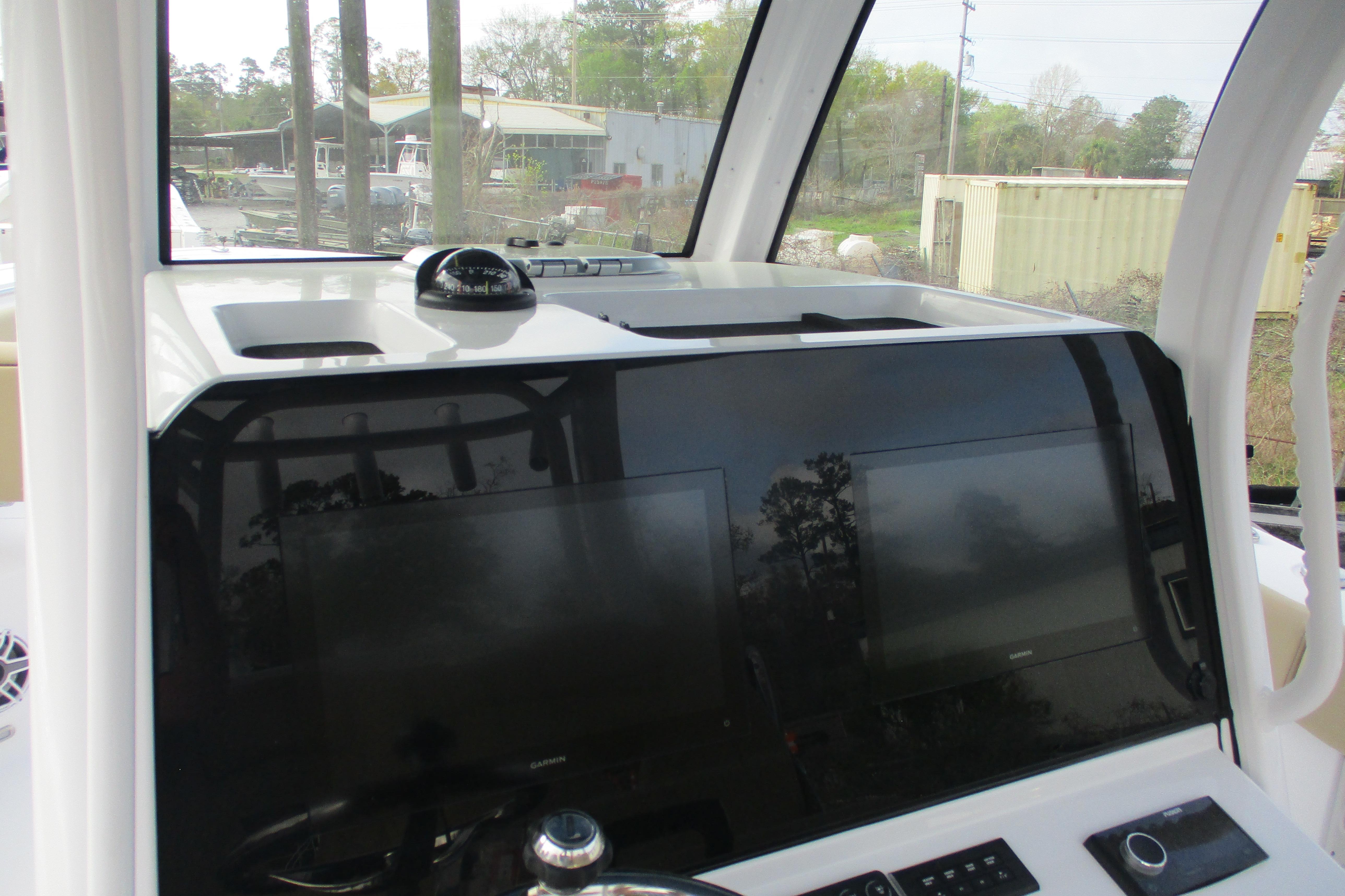 2026 Sportsman Open 302 Center Console dashboard with navigation screens and compass.