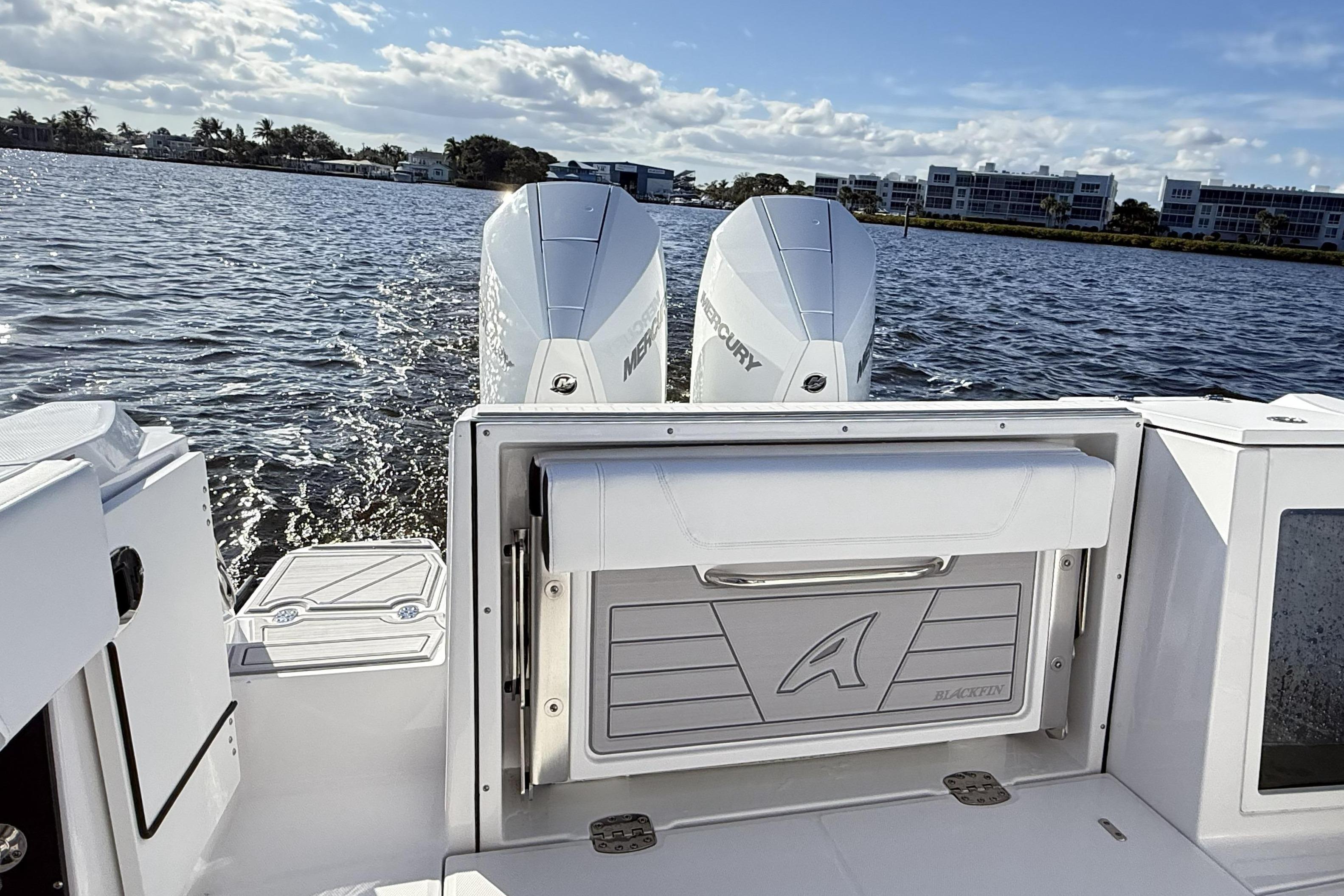 Blackfin 272 DC 2025 with Mercury engines on calm water.