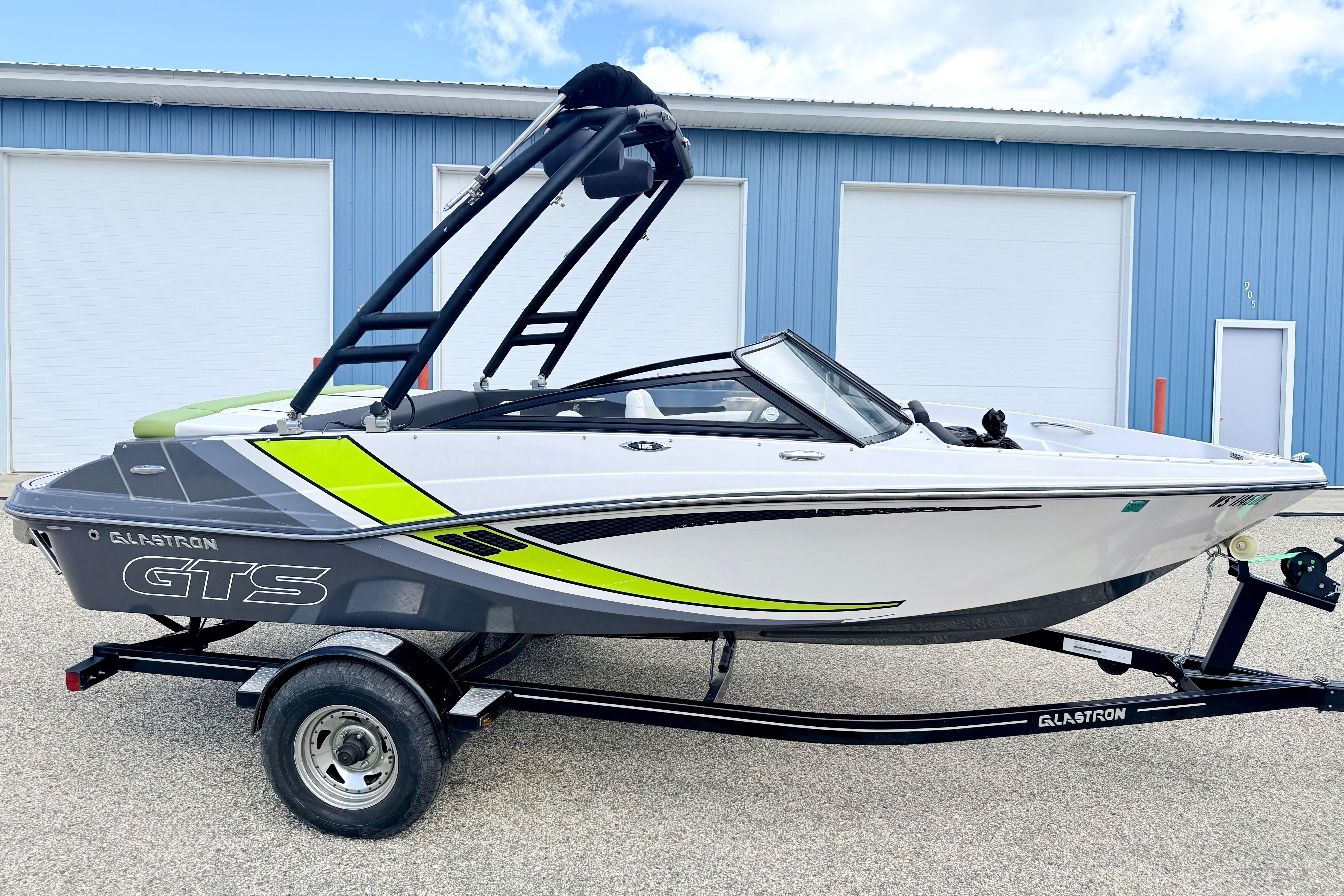 2018 Glastron GT 185 boat on trailer, featuring sleek design and vibrant accents.