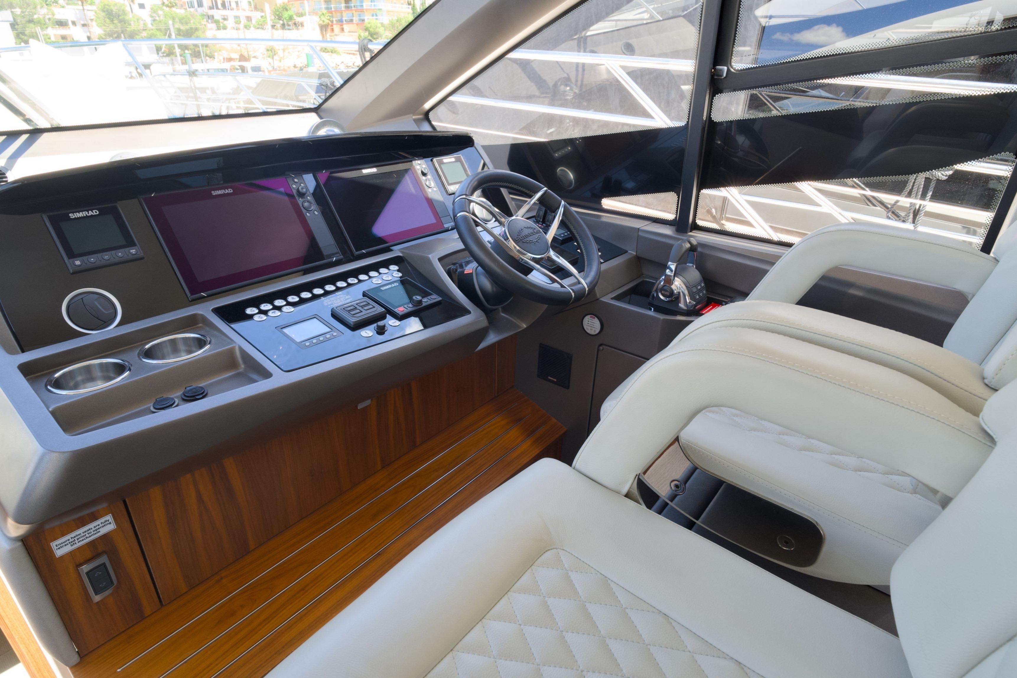 2019 Sunseeker Manhattan 52 yacht helm with modern controls and luxurious seating.
