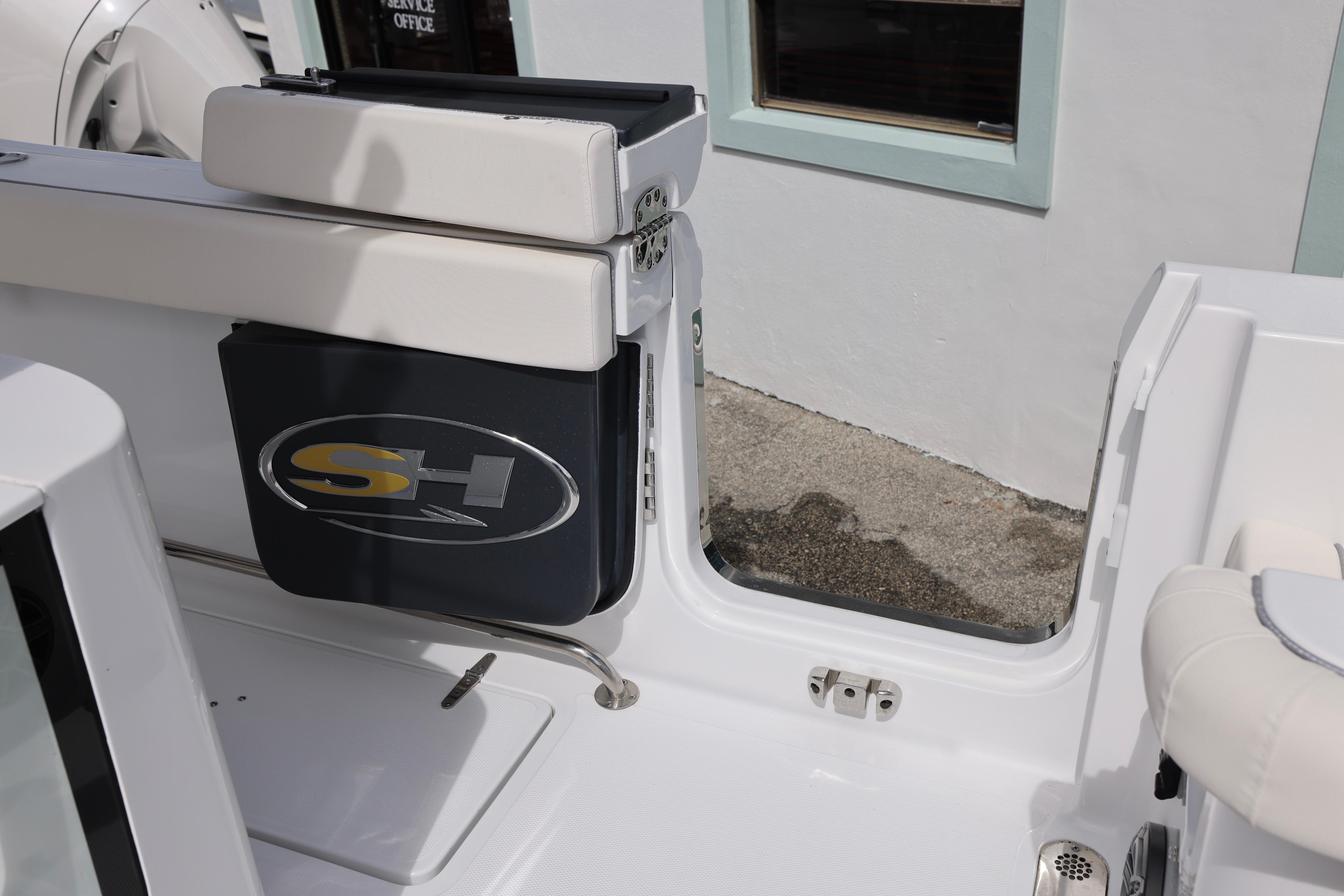 2026 Sea Hunt Gamefish 25 boat interior with SH logo, featuring sleek design elements.